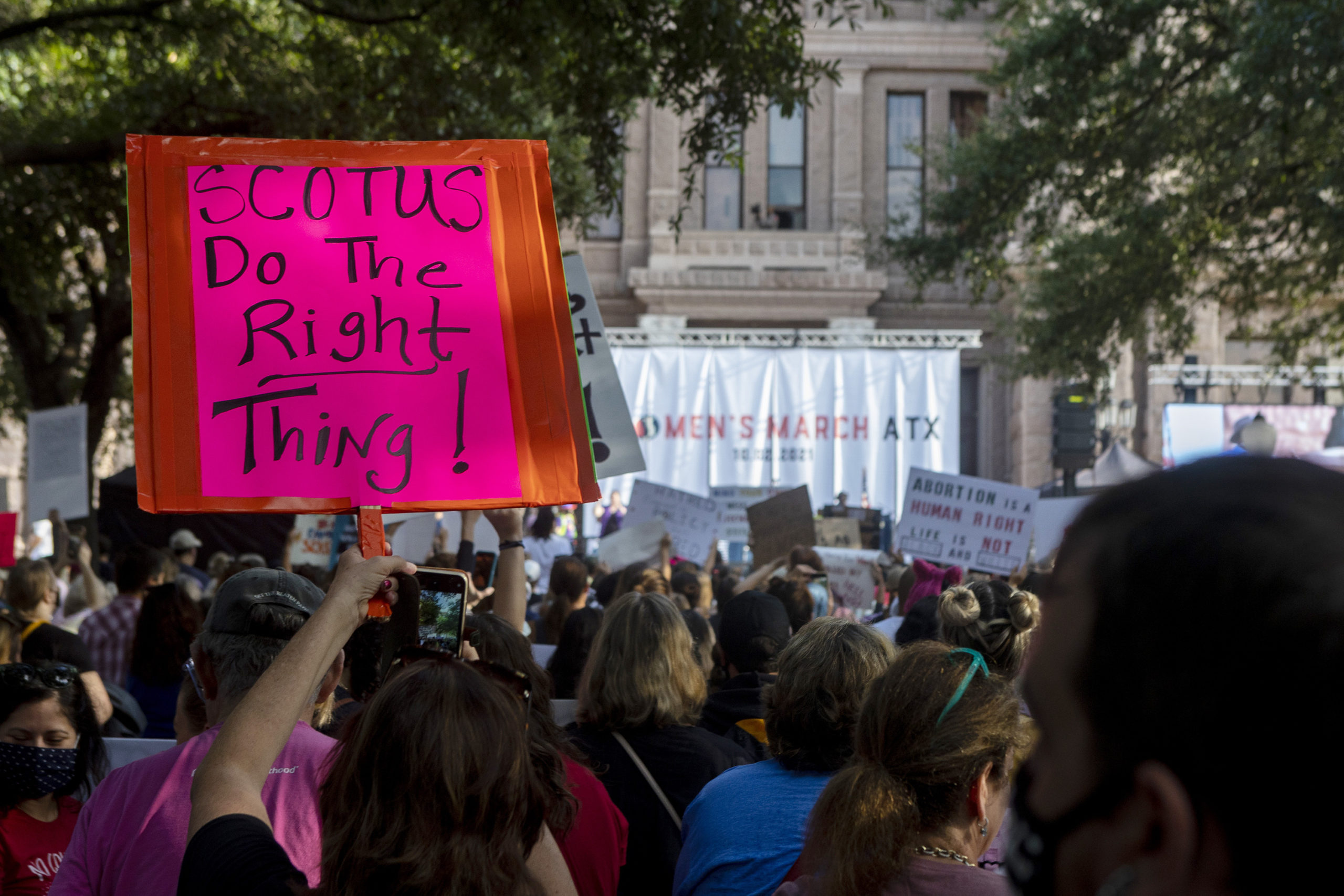 FILE - People attend the Women's March ATX rally, Oct., 2, 2021, at the Texas State Capitol in Aust...