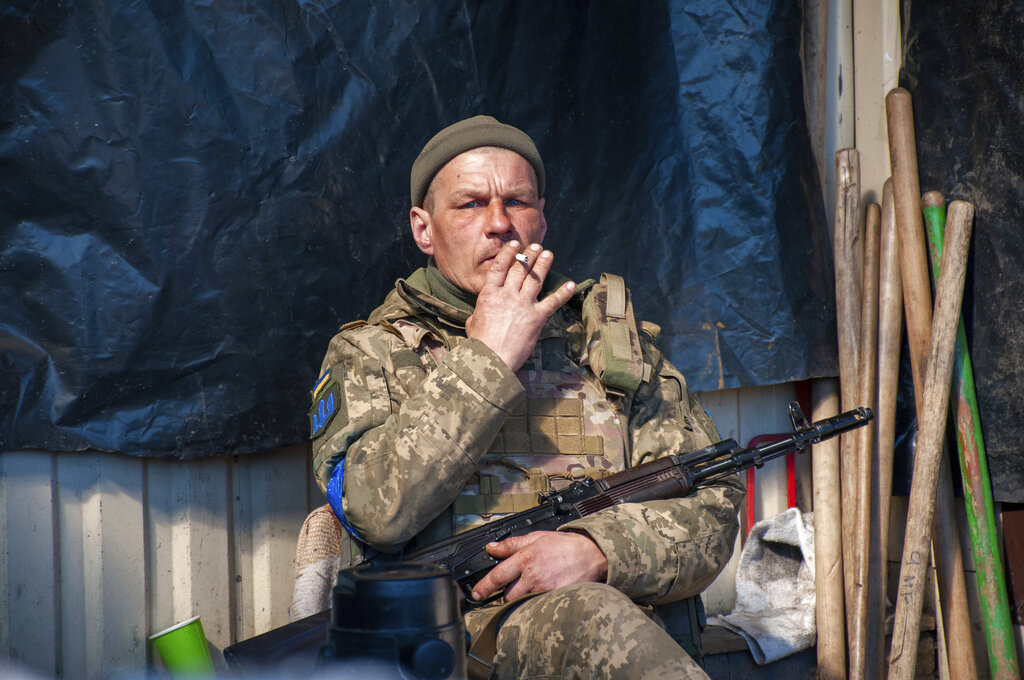 Ukrainian serviceman has a rest on his position in Kharkiv, Ukraine, Tuesday, March 22, 2022. (AP P...