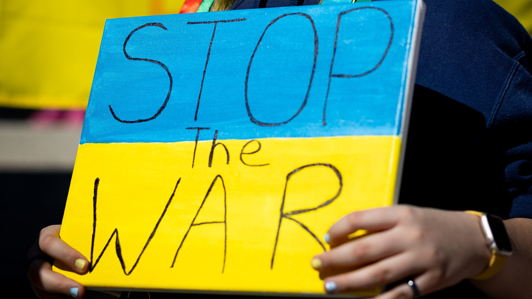 Anastasiya Sayer, 11, joins others in rallying against the war in Ukraine at the Capitol in Salt La...