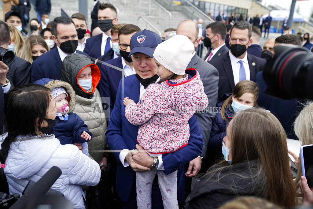 President Joe Biden meets with Ukrainian refugees and humanitarian aid workers during a visit to PG...