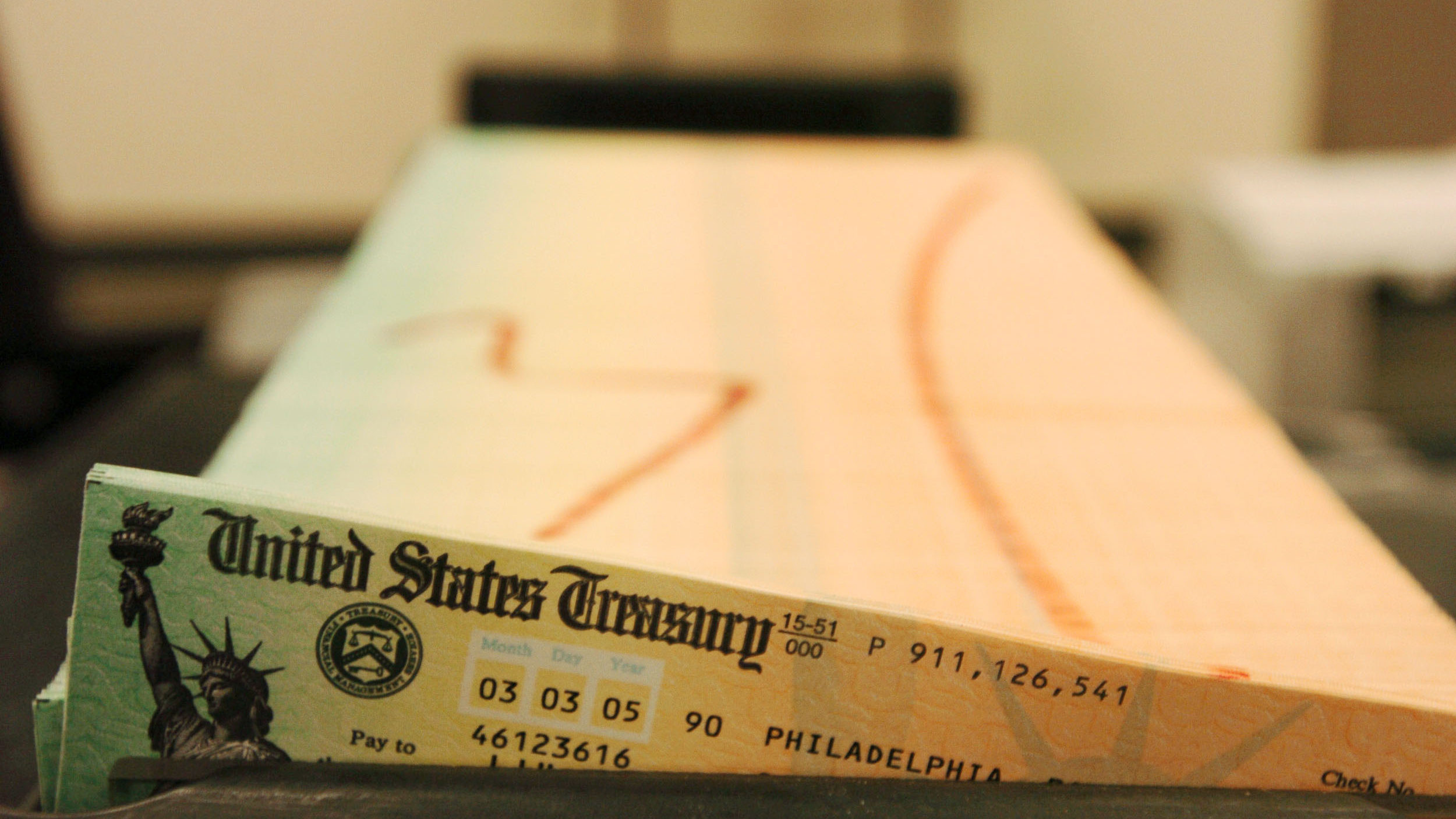 In this Feb. 11, 2005 file photo, trays of printed social security checks wait to be mailed from th...