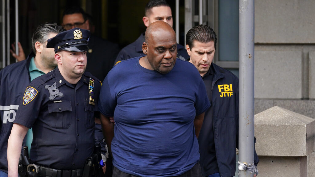 New York City Police and law enforcement officials lead subway shooting suspect Frank R. James, 62,...