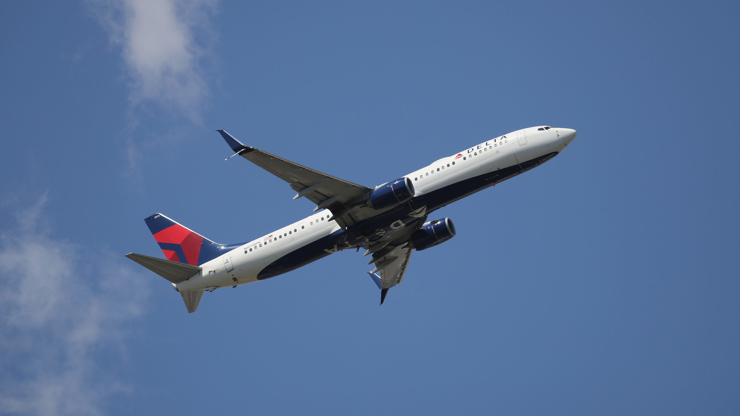 A Delta Airlines flight experiences turbulence, causing the injury of three passengers. (Photo by B...