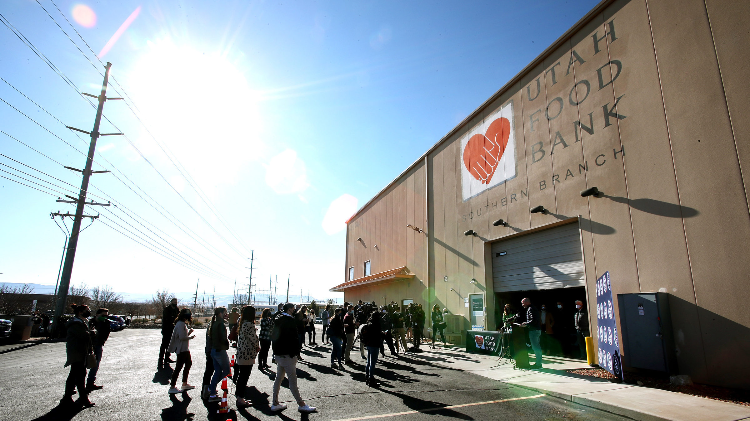 People outside of the St. George food bank. The Springville Utah Food Bank will provide services to...