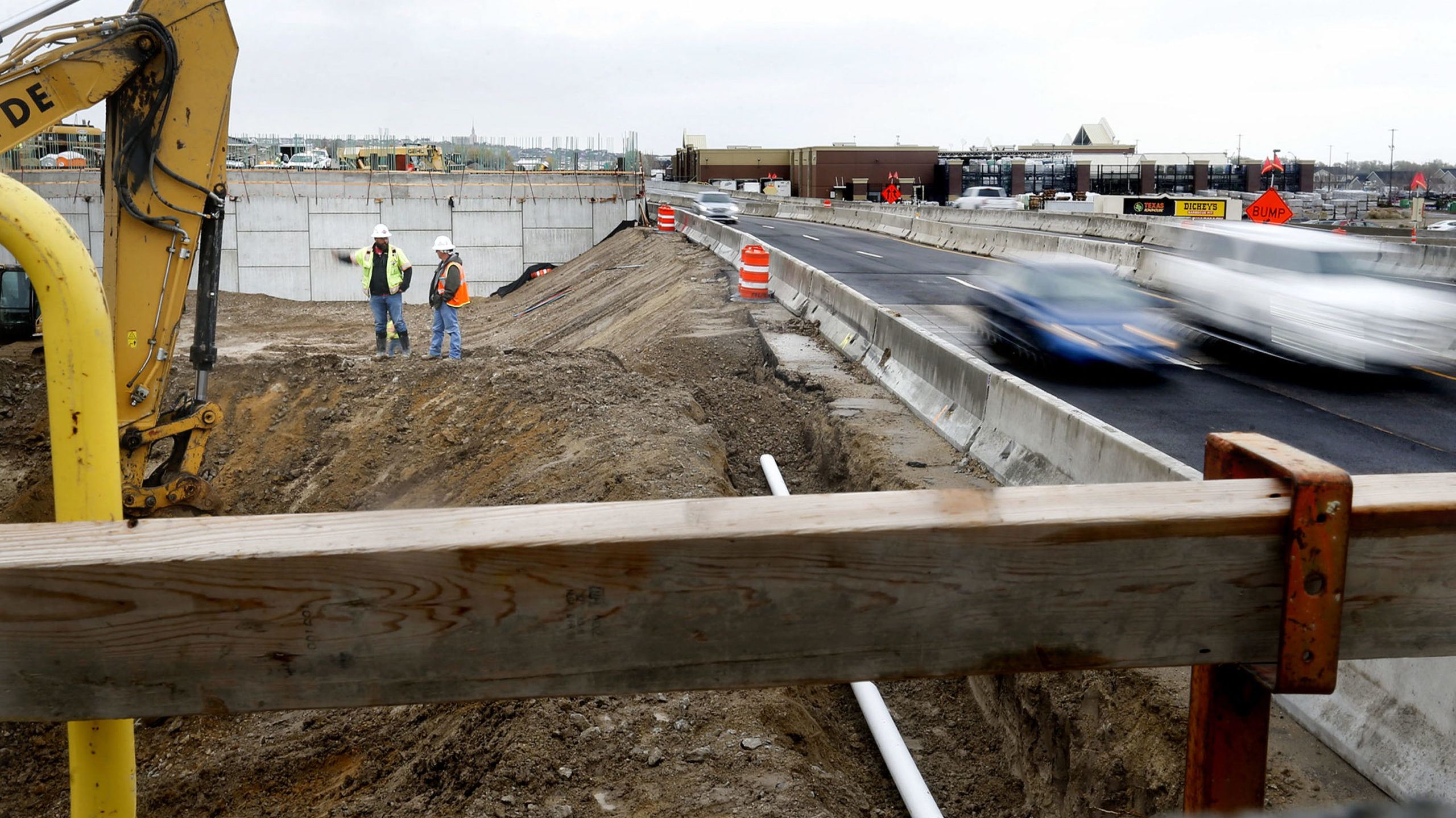 Traffic moves through the construction zone for the Bangerter Highway interchange at 12600 South in...