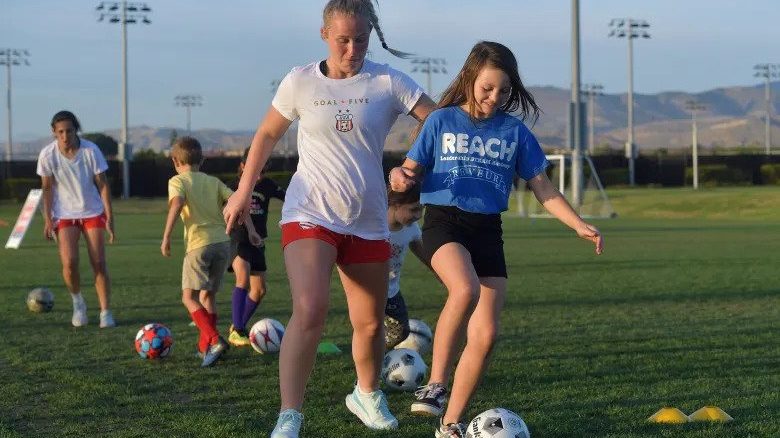 Team USA’s Sophie Post works with Kylee during a soccer clinic after USA Deaf Soccer competed in ...