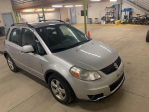 A silver car; Bogslag's silver 2012 Suzuki SX4 is pictured. Photo credit: South Salt Lake Police Department.