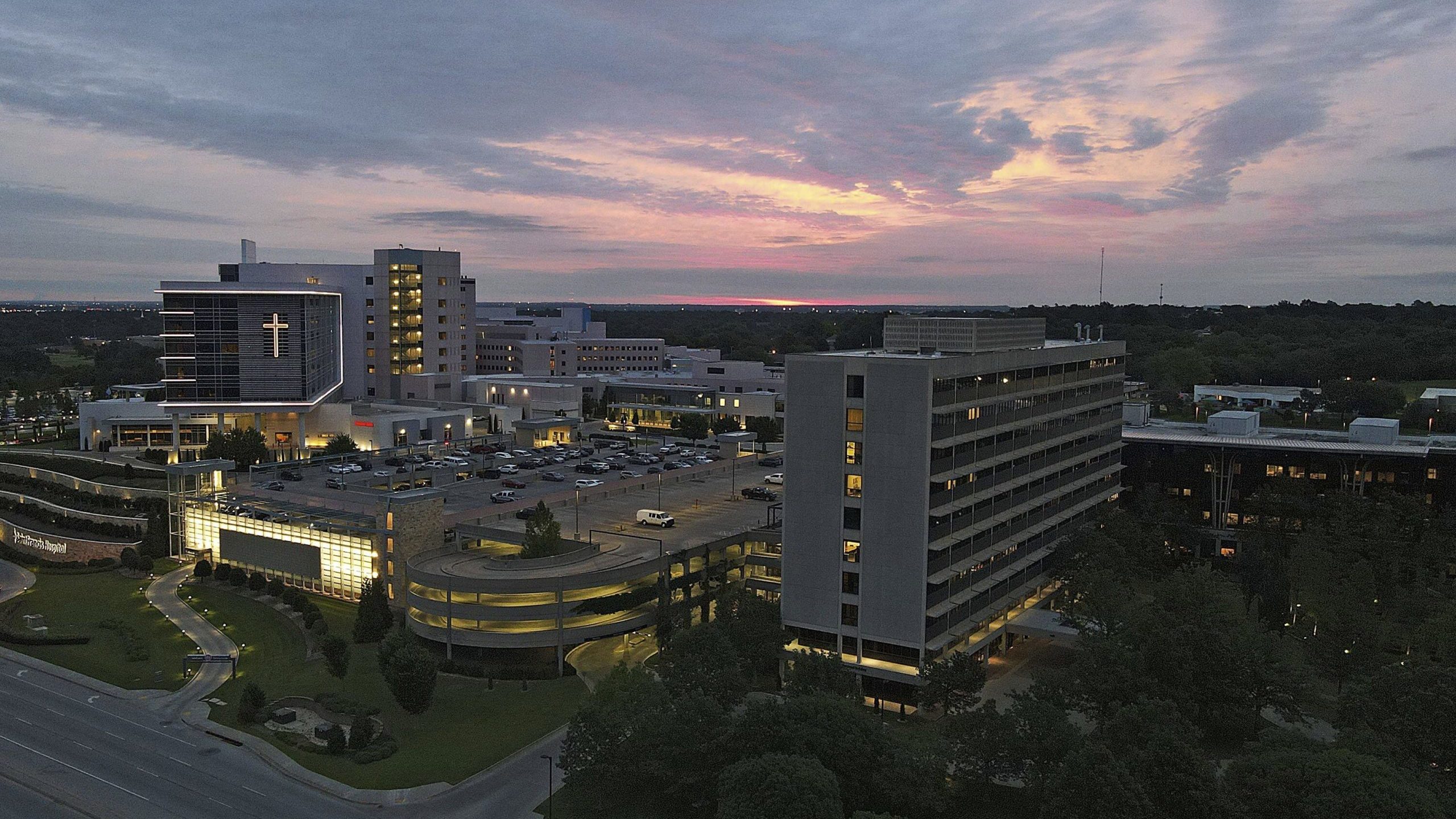 The sun rises over the St. Francis Hospital campus, Thursday, June 2, 2022, in Tulsa, Okla. Authori...