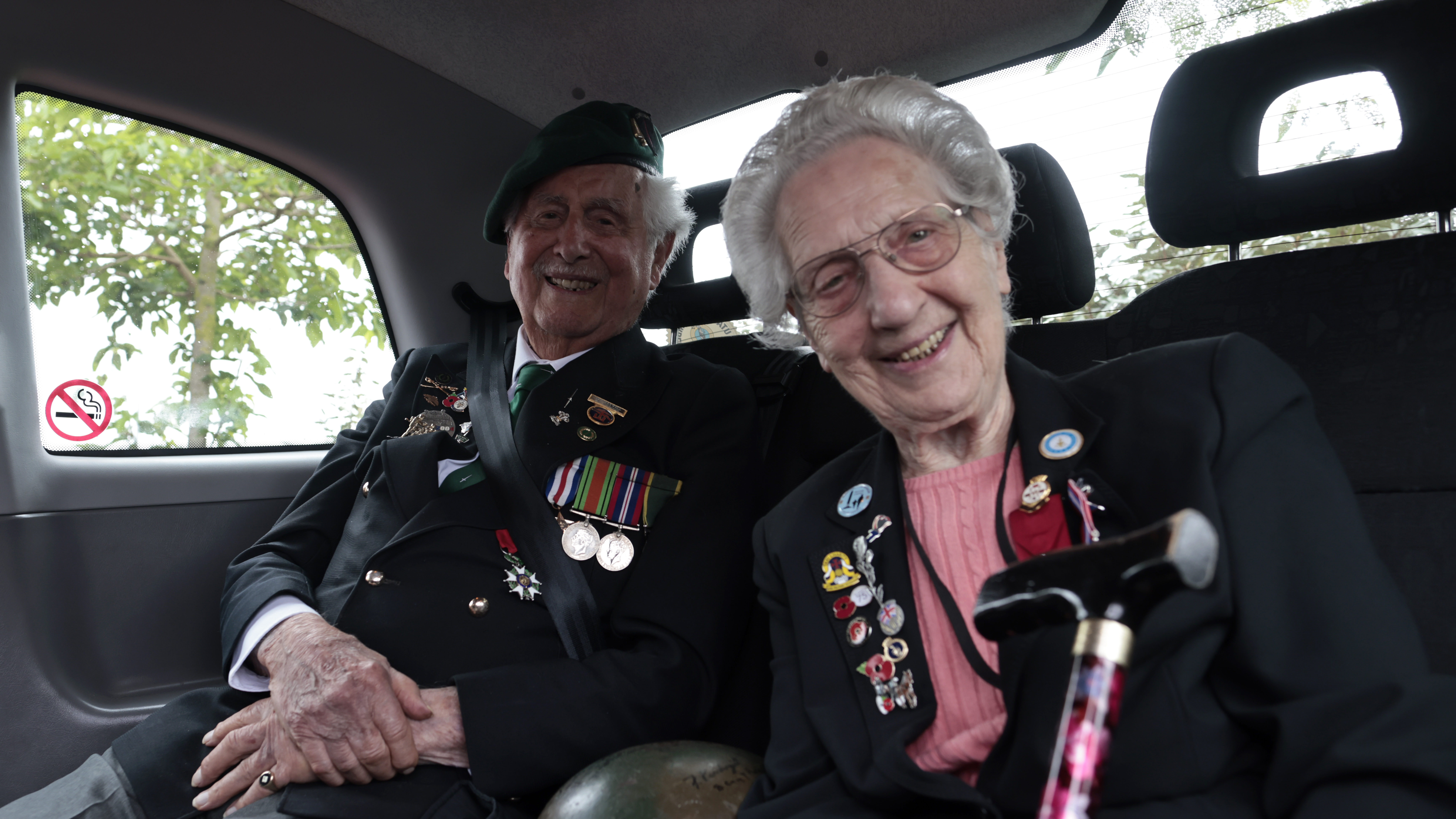 British veterans Roy Maxwell and Mary Scott arrive in a British Taxi Charity for Military Veterans ...