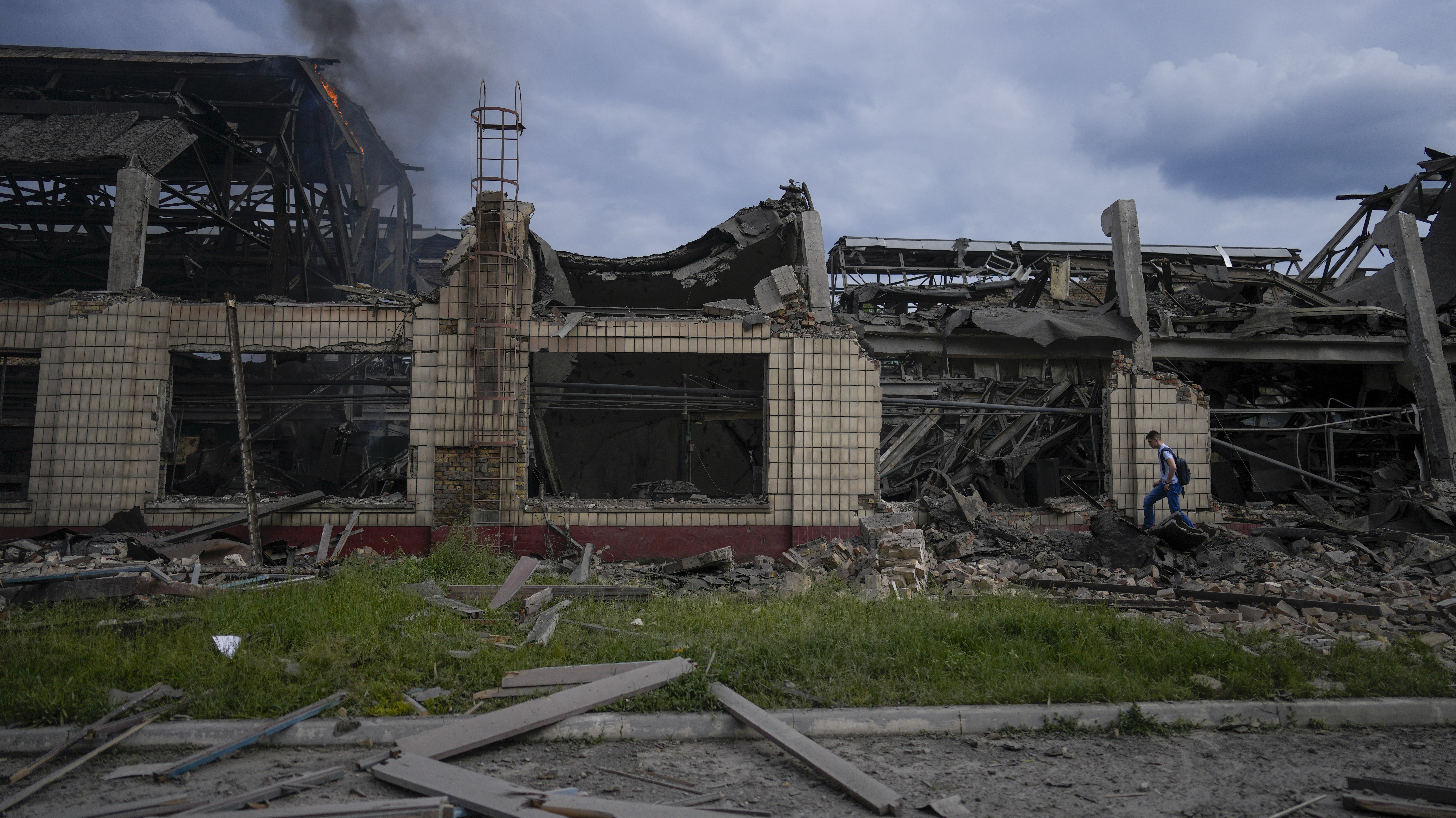 Smokes raises from a railway service facility hit by a Russian missile strike in Kyiv, Ukraine, Sun...