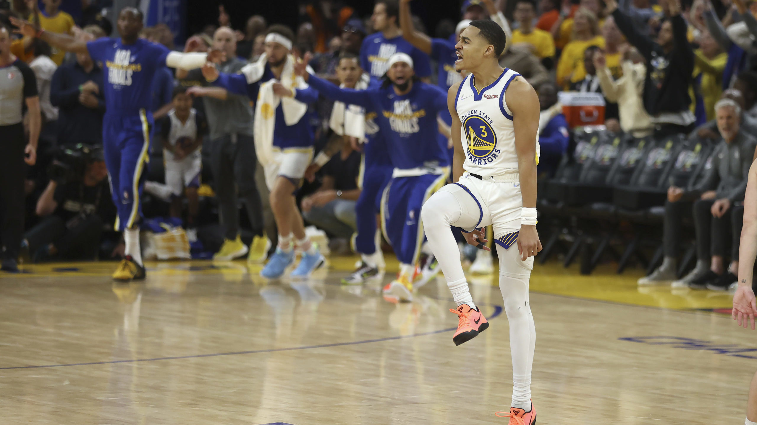 CORRECTS TO GAME 2 INSTEAD OF GAME 1 - Golden State Warriors guard Jordan Poole (3) celebrates afte...