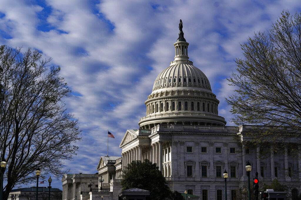 FILE - The Capitol is seen in Washington, early Friday, April 1, 2022. The House committee investig...