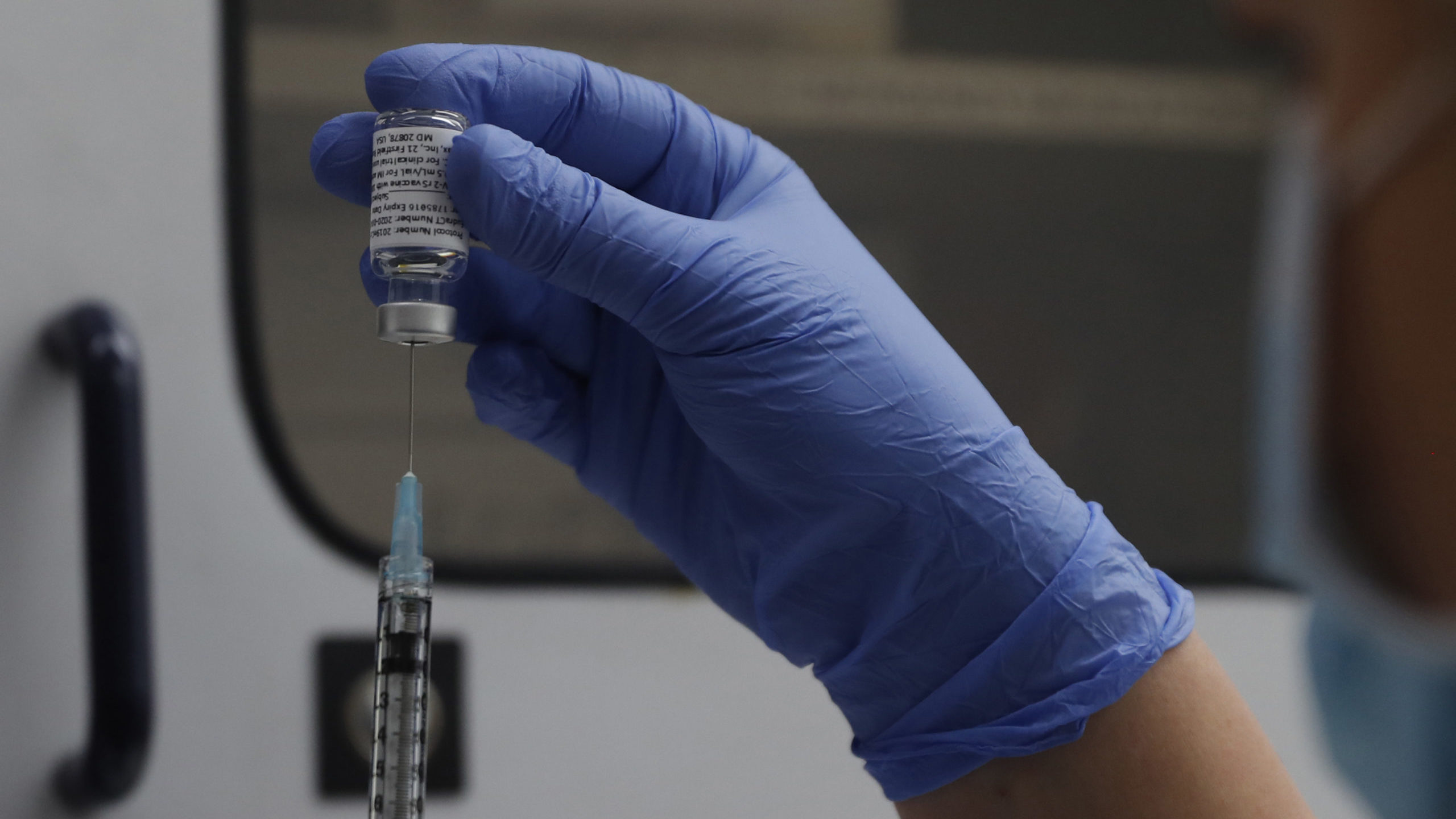 FILE - A vial of the Phase 3 Novavax coronavirus vaccine is seen ready for use in the trial at St. ...