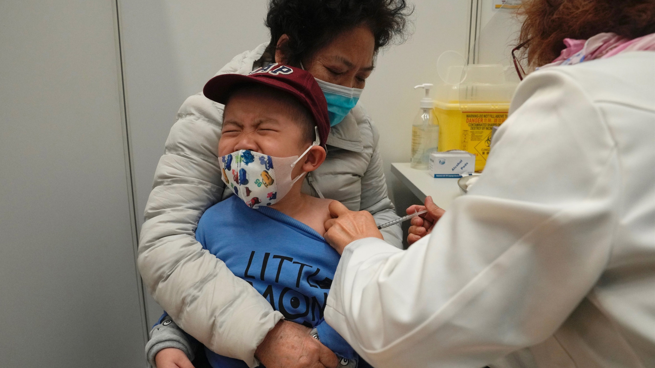 a small boy recieves a COVID-19 vaccine in China...