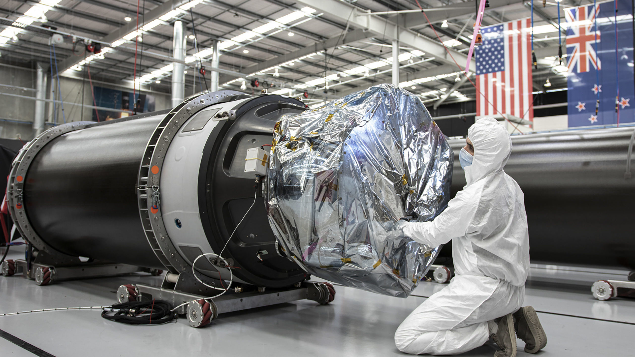 A technician works on a component of Rocket Lab's Electron rocket ahead of the launch on the Mahia ...