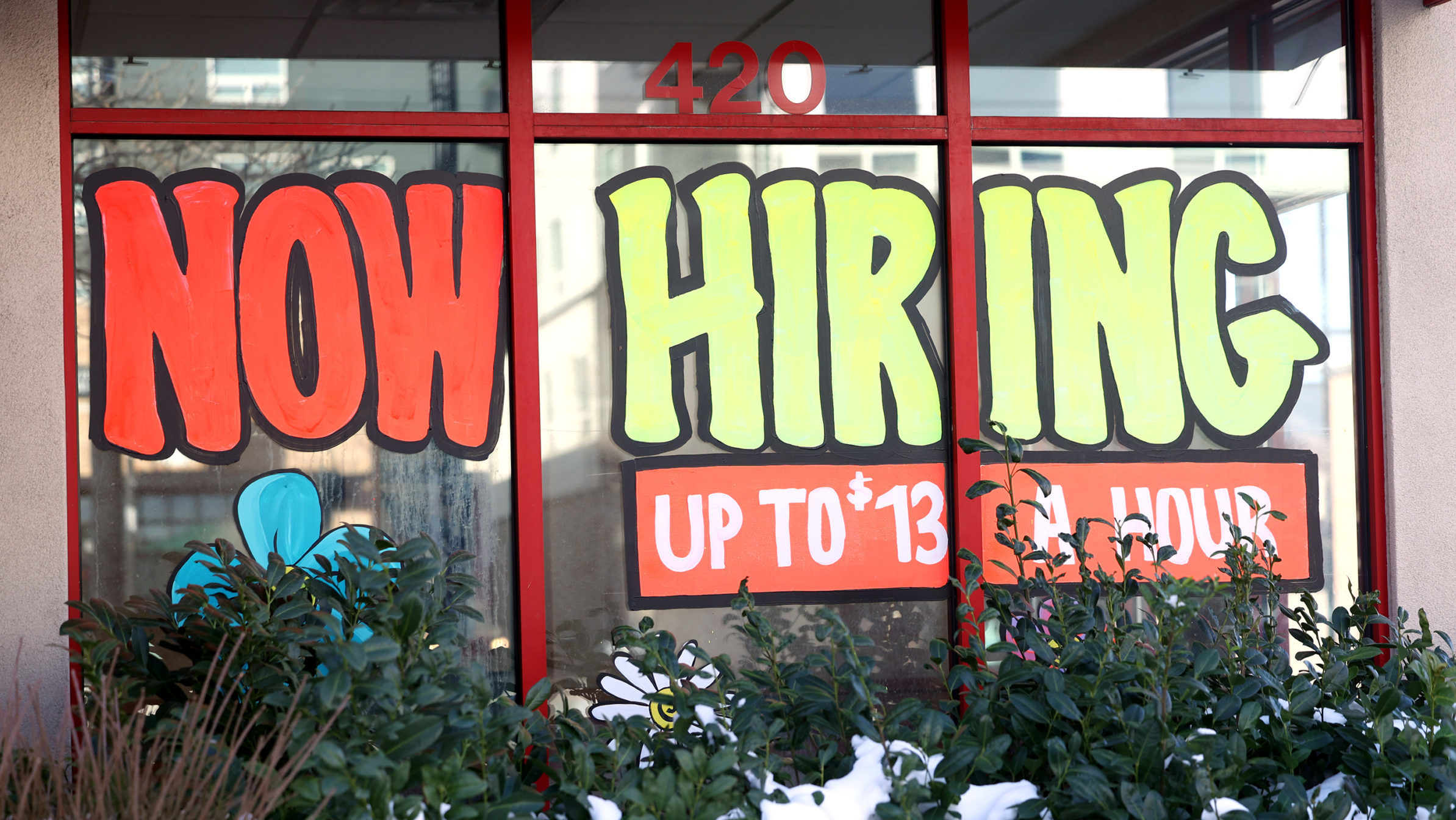 A now hiring sign in an Arby's window.; the Utah employment summary for May showed a slight slowing...