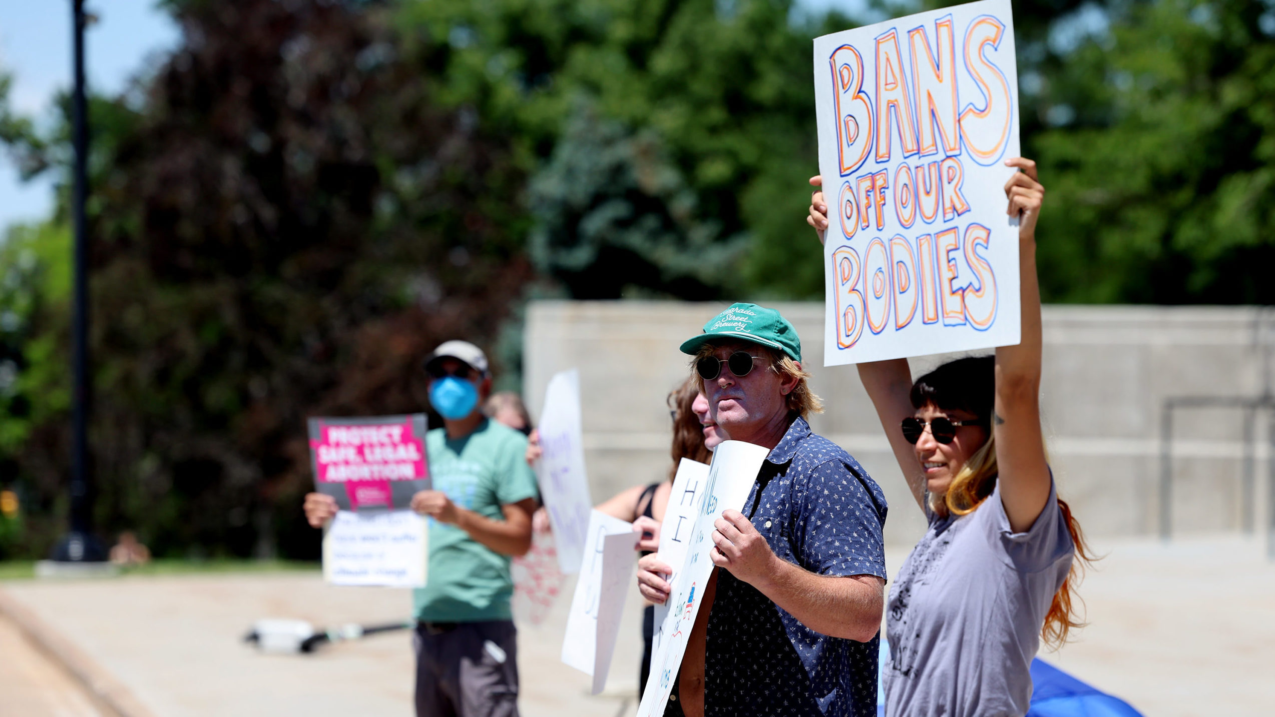 Protesters hold signs and chant at the Utah Capitol in Salt Lake City on Friday, June 24, 2022, as ...