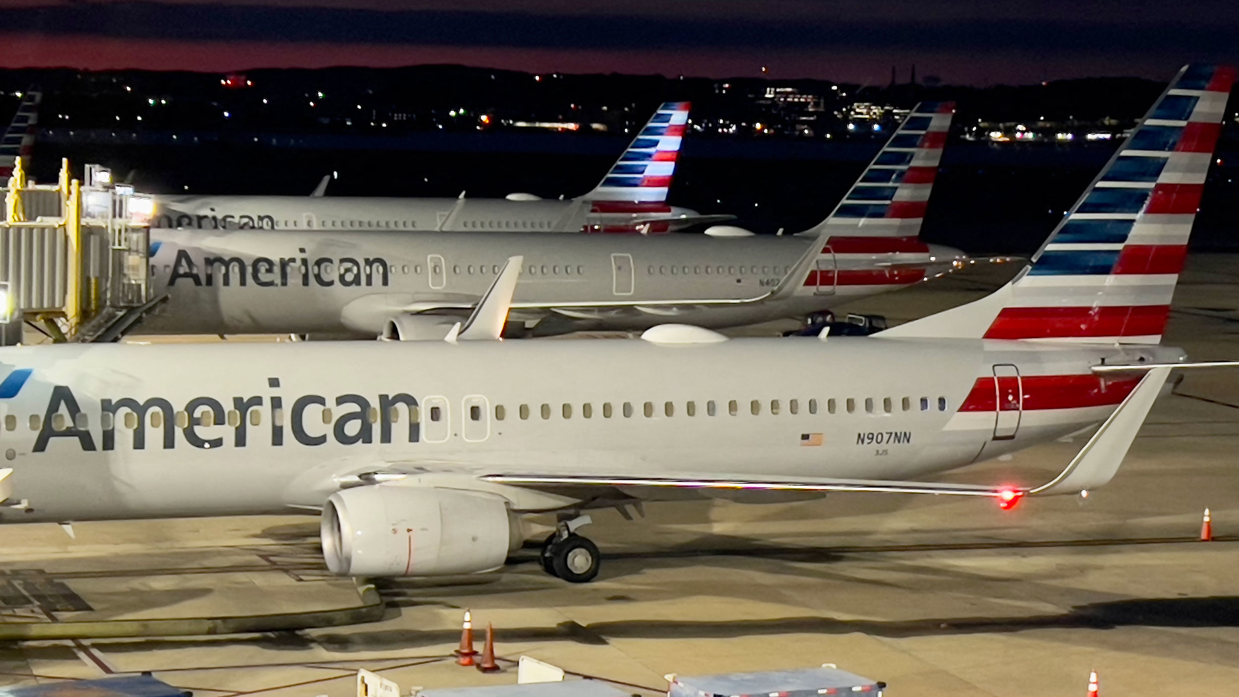 American Airlines planes sit at gates at Ronald Reagan Washington National Airport (DCA) in Arlingt...