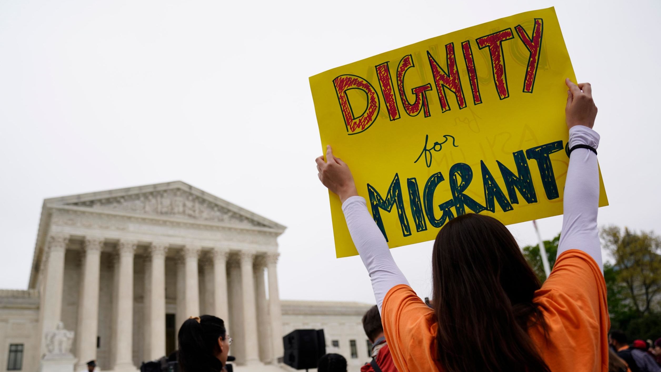 Immigration activists rally outside the US Supreme Court in Washington, DC on April 26. Photo credi...