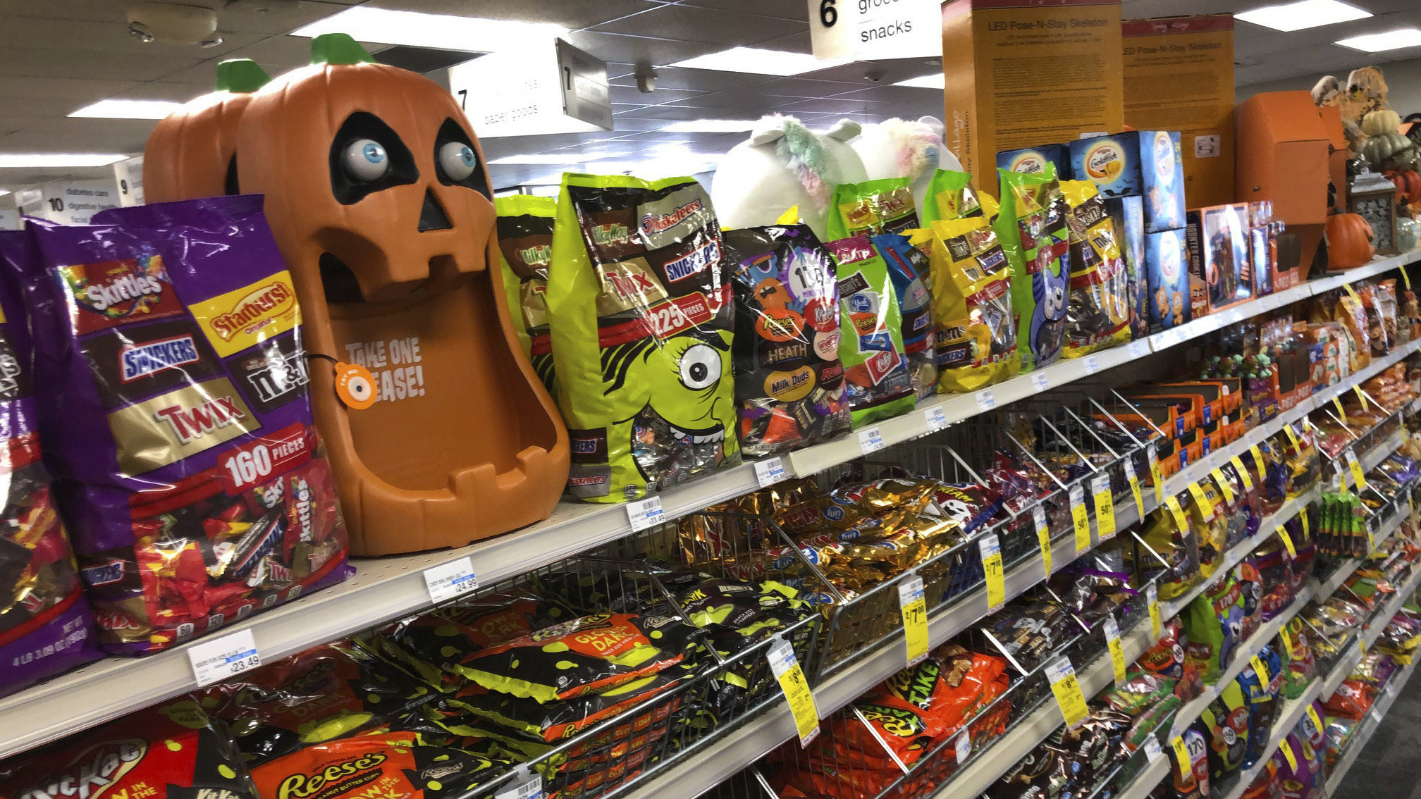 Halloween candy is stocked on shelves at a store. Hershey candy may be sparse...