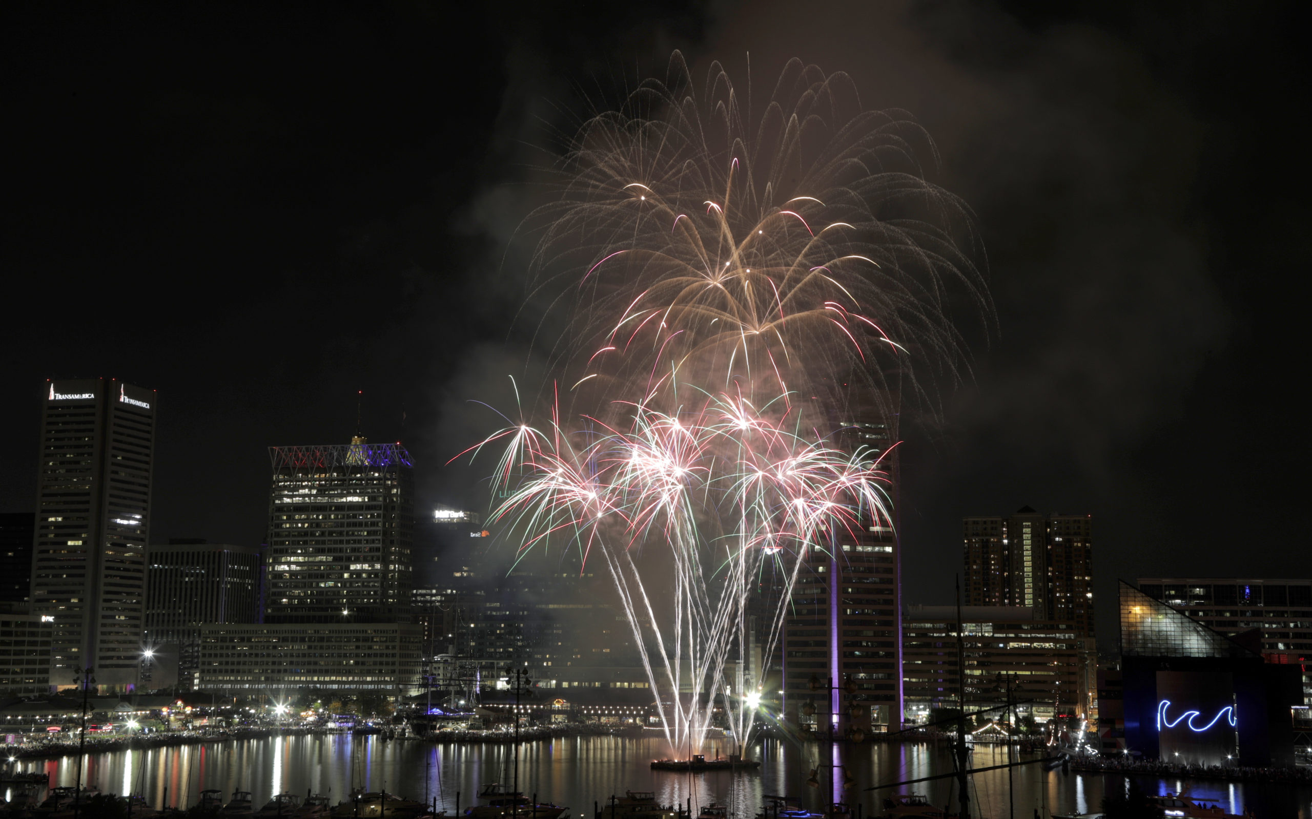 FILE - Fireworks explode over Baltimore's Inner Harbor during the Ports America Chesapeake 4th of J...