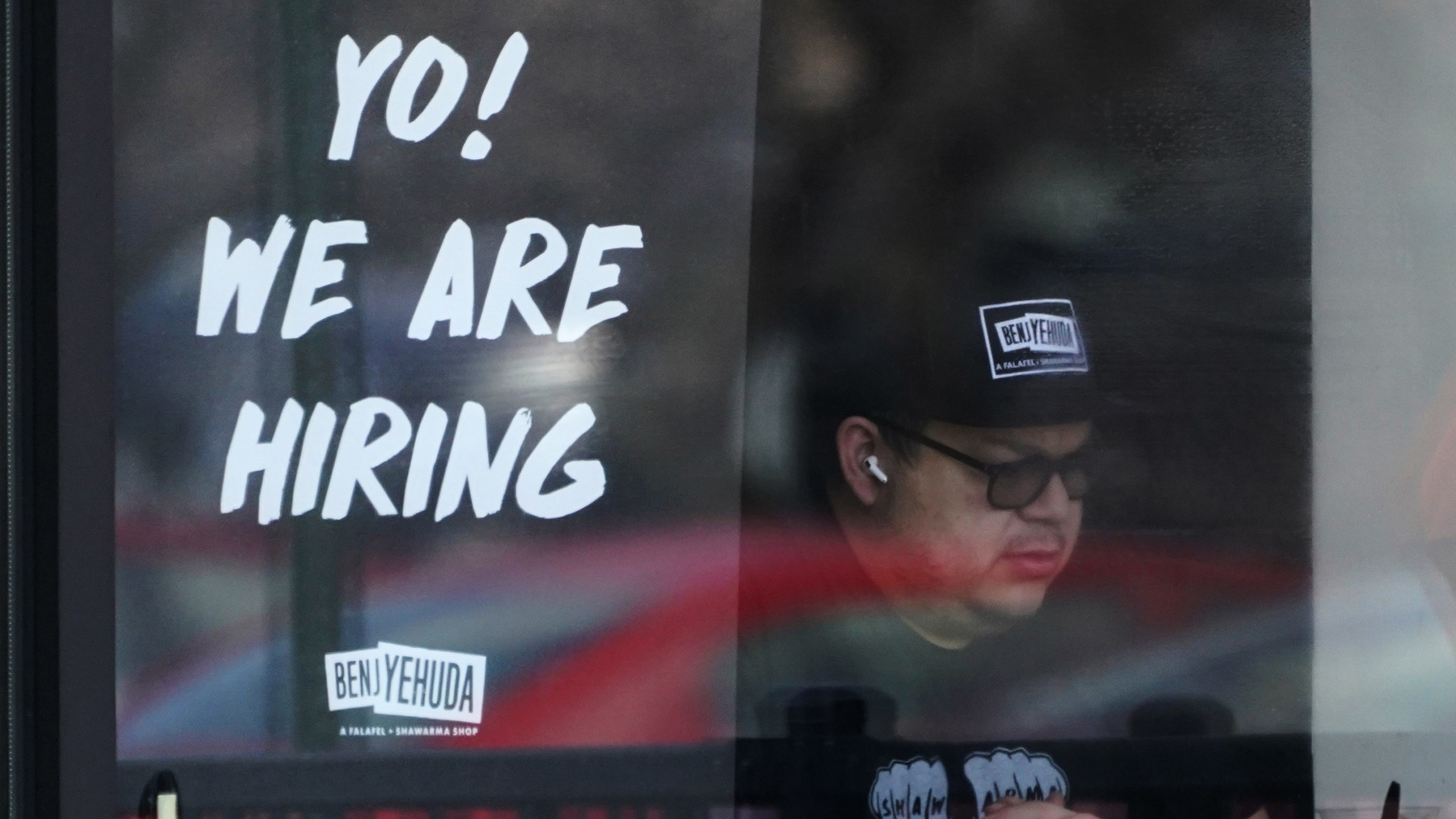A hiring sign is displayed at a restaurant in Schaumburg, Ill., Friday, April 1, 2022. More America...