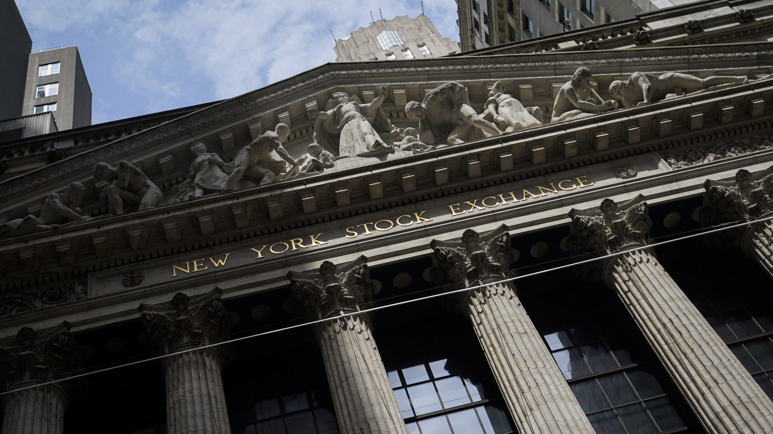 FILE - Sunlight shines on the facade of the New York Stock Exchange, Friday, July 8, 2022, in New Y...
