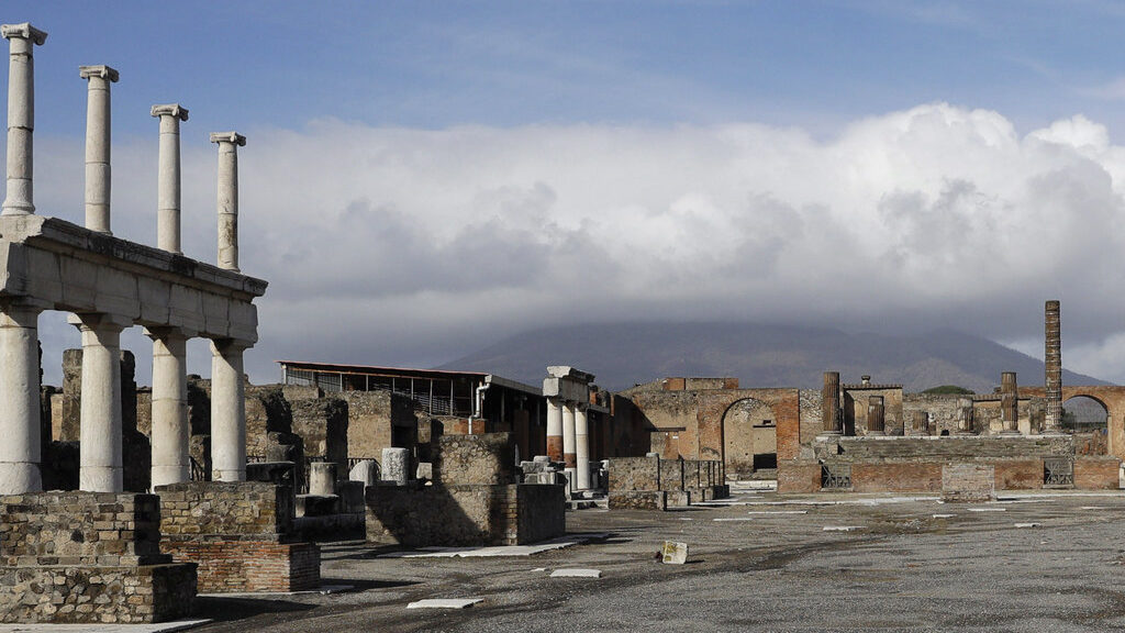 FILE - Clouds hang over the Vesuvius volcano in Pompeii, southern Italy, Jan. 25, 2021. An American...