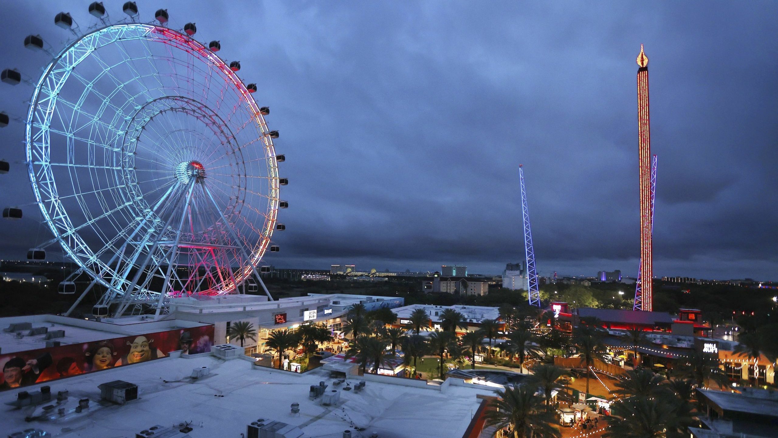 ICON Park attractions, The Wheel, left, Orlando SlingShot, middle, and Orlando FreeFall, right, are...