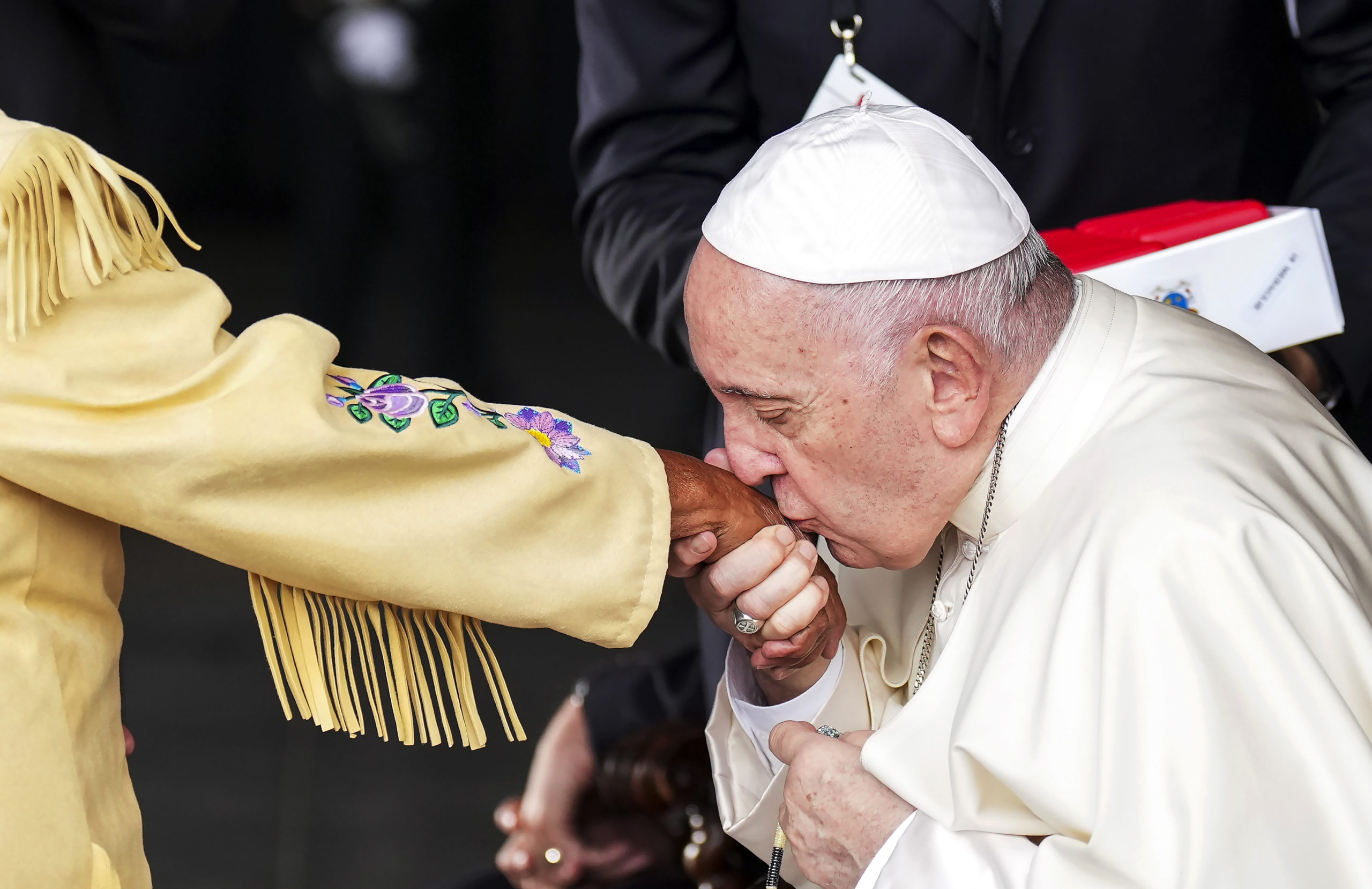 Pope Francis kisses the hand of residential school survivor Elder Alma Desjarlais of the Frog Lake ...
