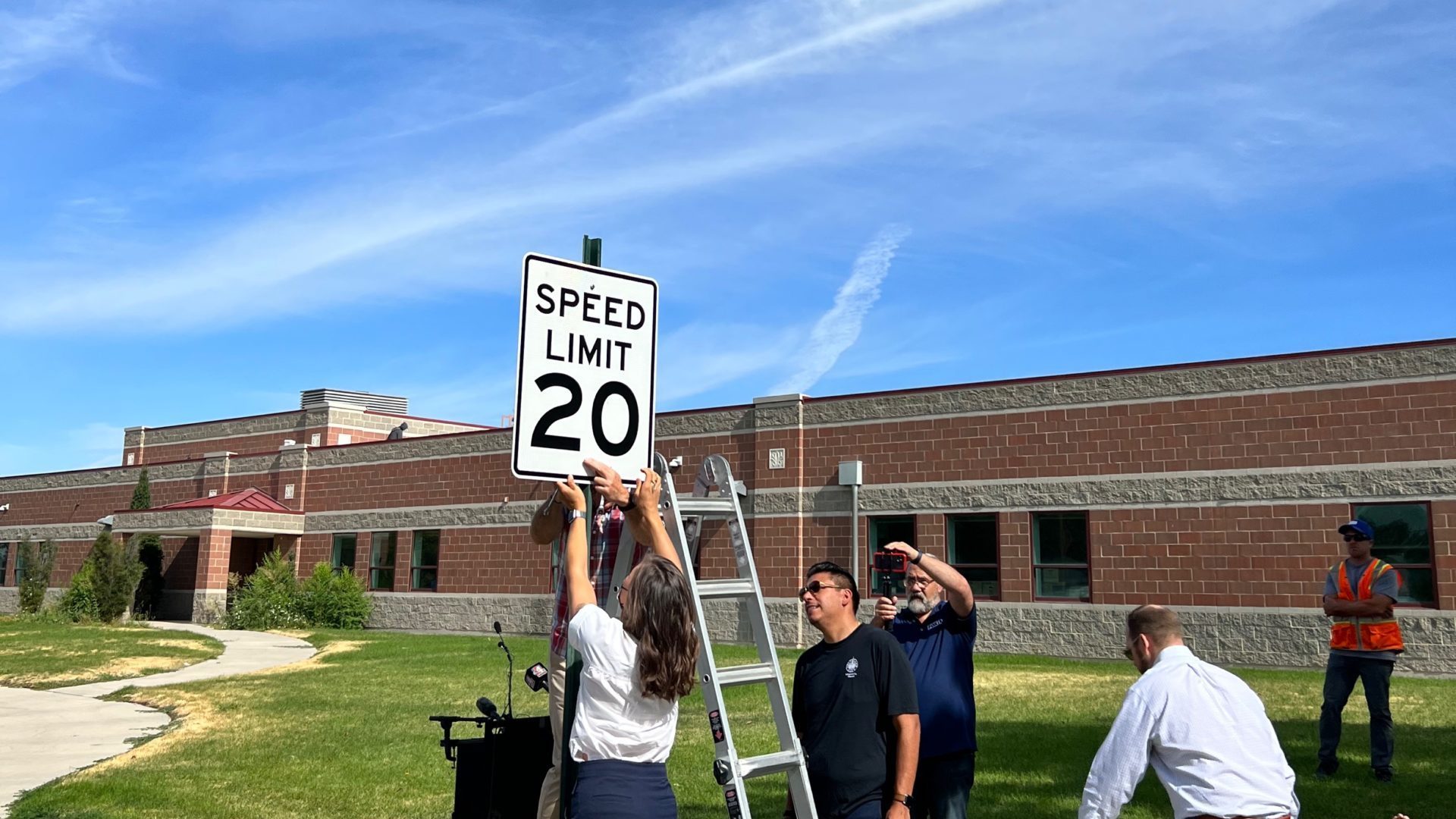Salt Lake City Mayor helps install the first of many new 20 mph signs throughout Salt Lake City....