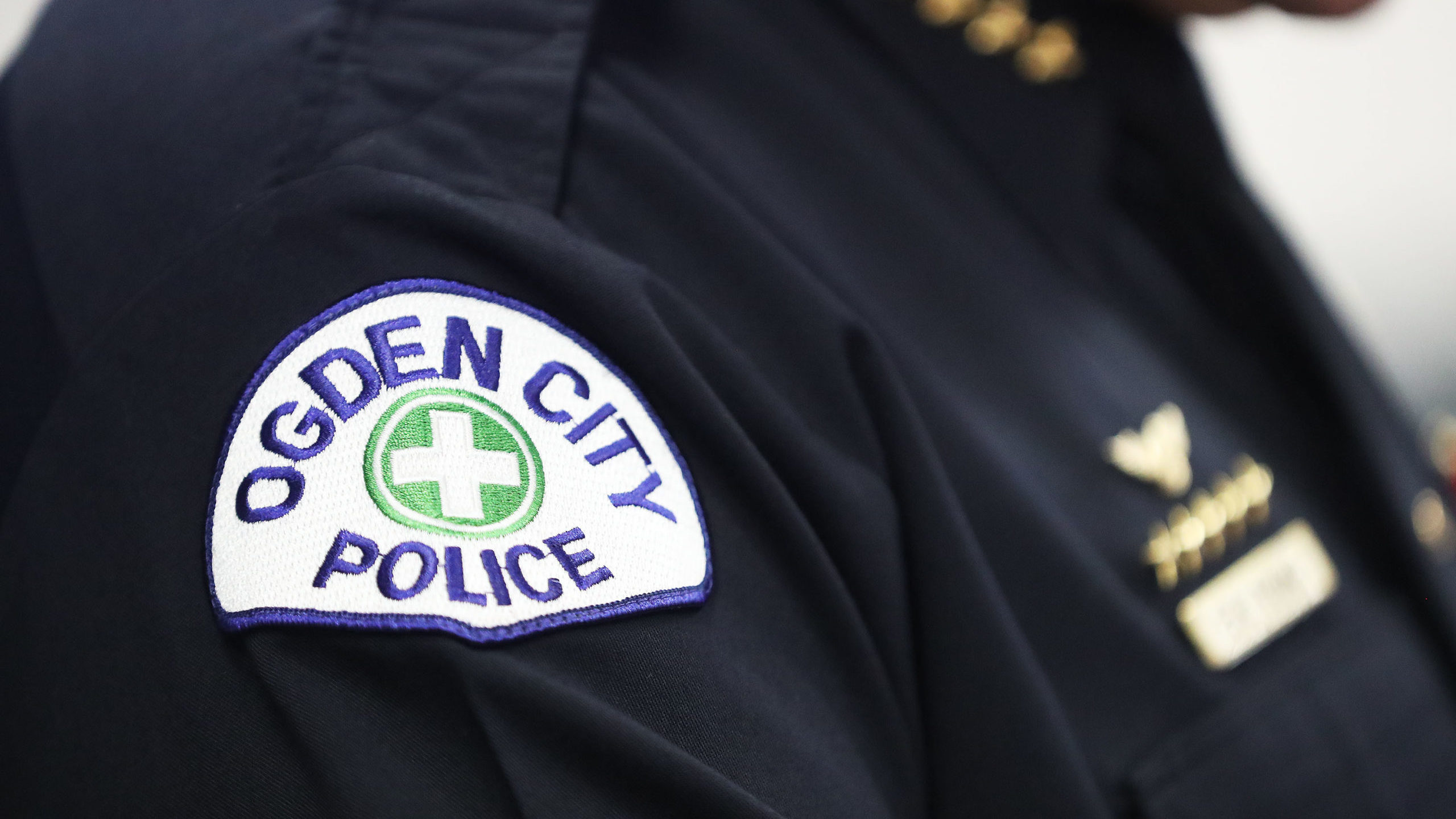 An "ogden city police" patch is pictured...