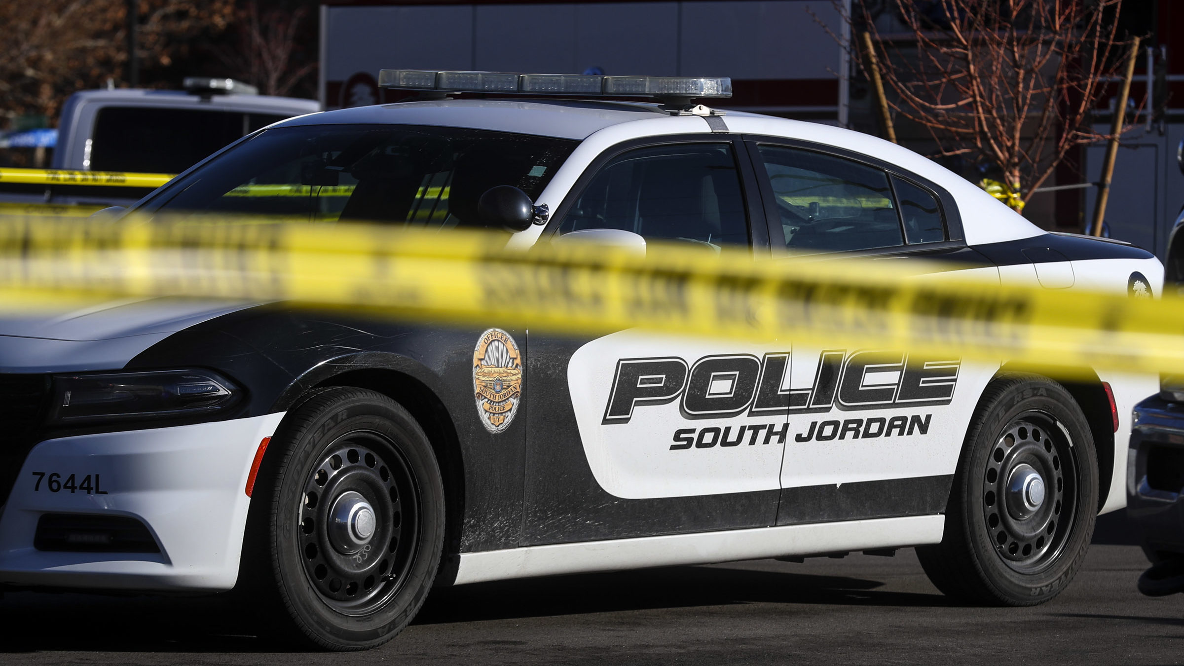 South Jordan police cars pictured., a construction worker died after a fall in south jordan...