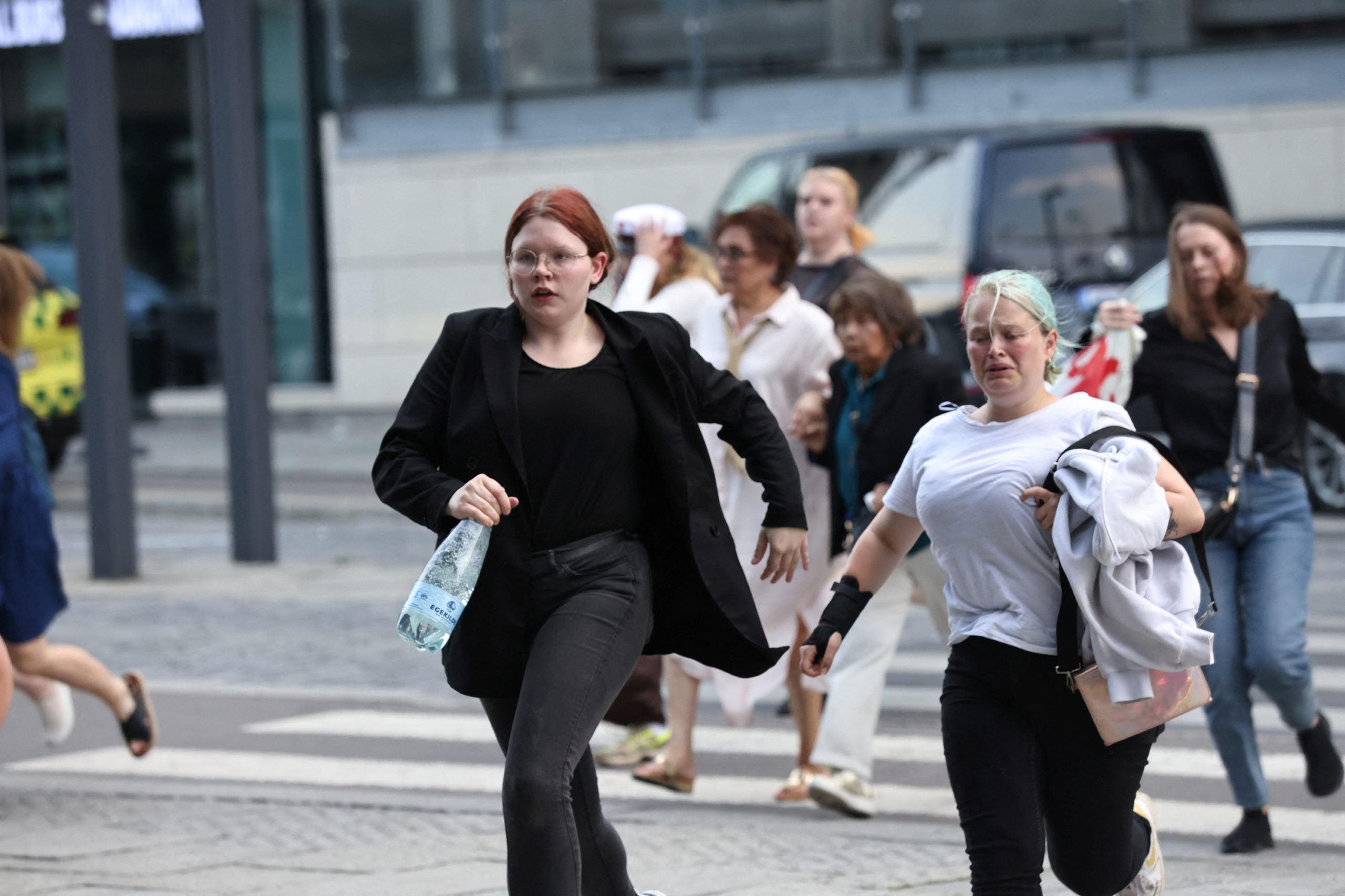 People leave Field's shopping centre, after Danish police said they received reports of shooting, i...