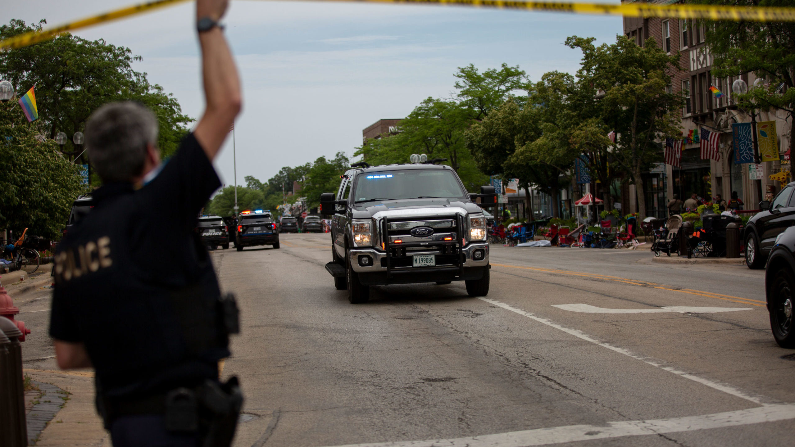 First responders work the scene of a shooting at a Fourth of July parade on July 4, 2022, in Highla...