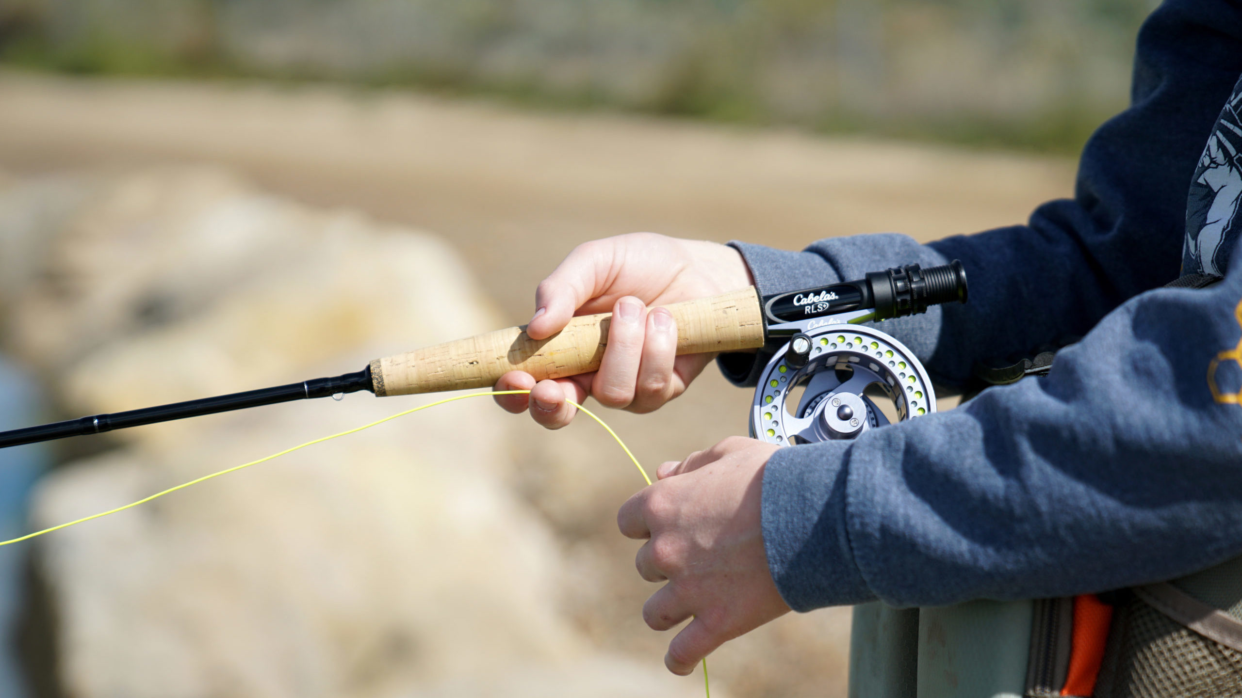 A person fly fishing is pictured. Utah hunting and fishing permits/licenses may see an increase...