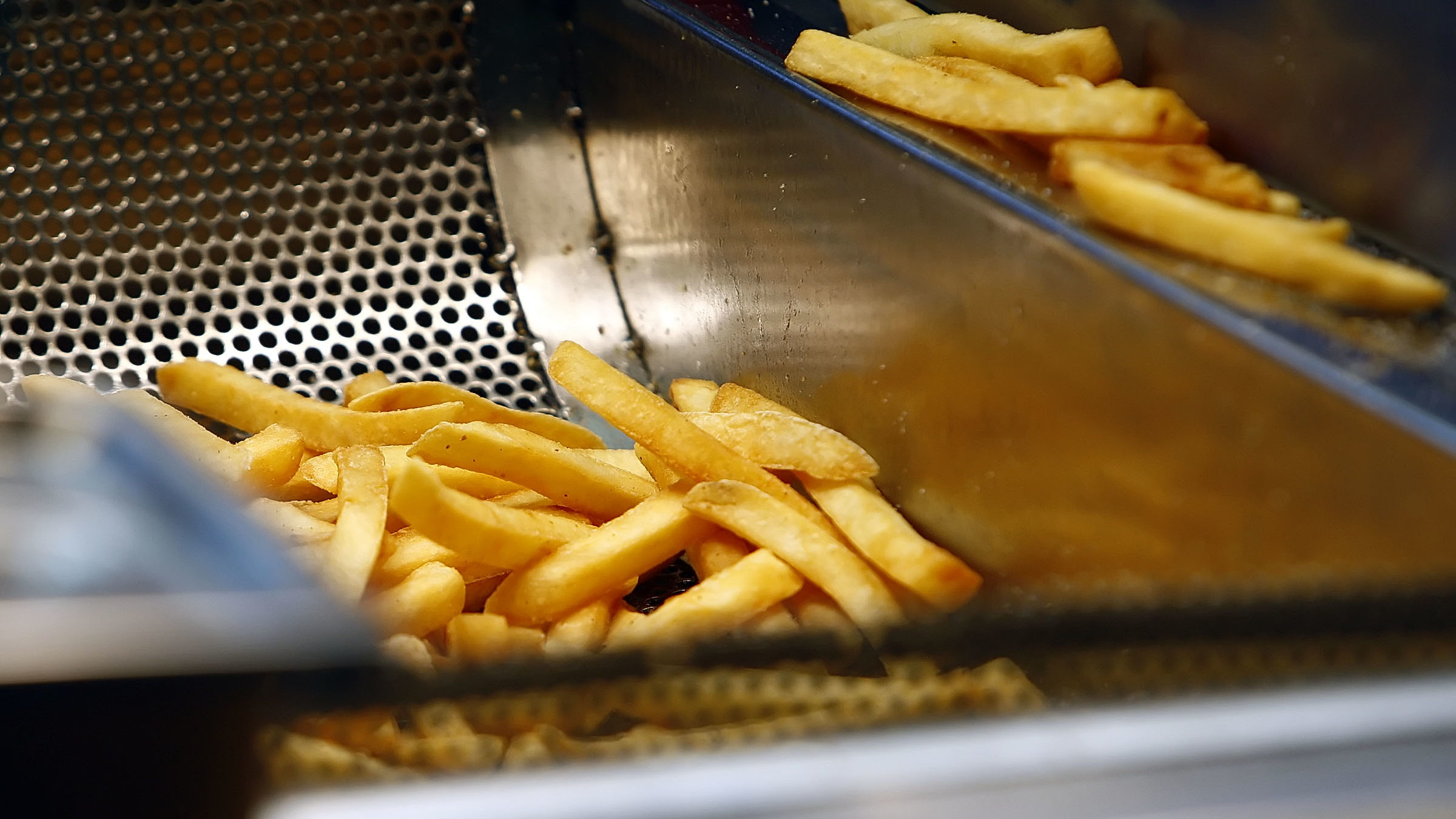 french fries are pictured. Inflation is raising lunch prices...