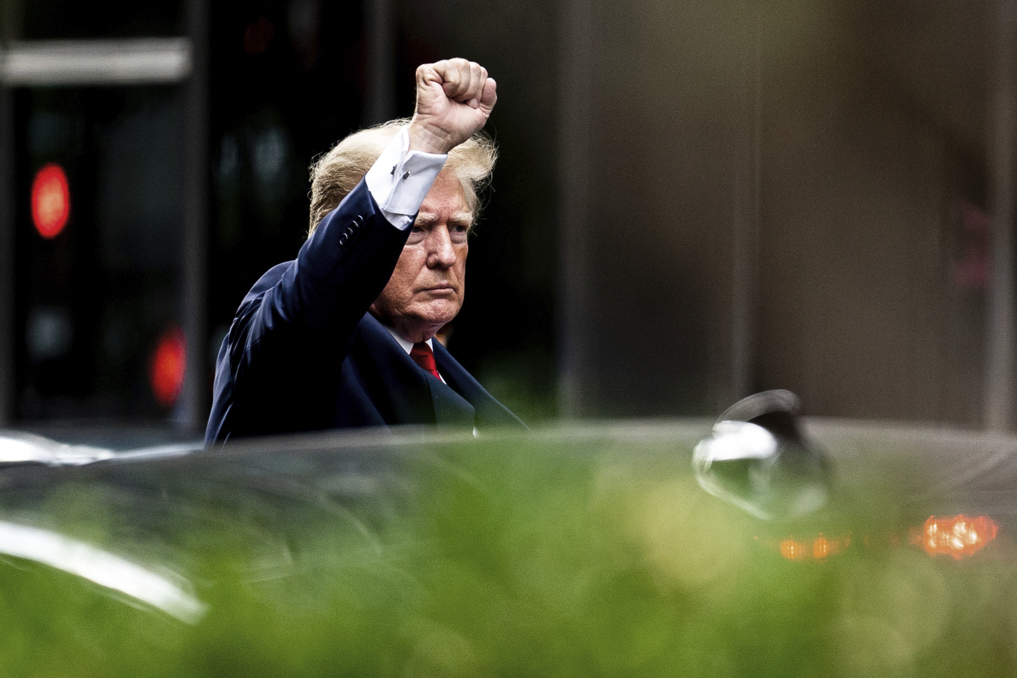 President Trump raises fist...