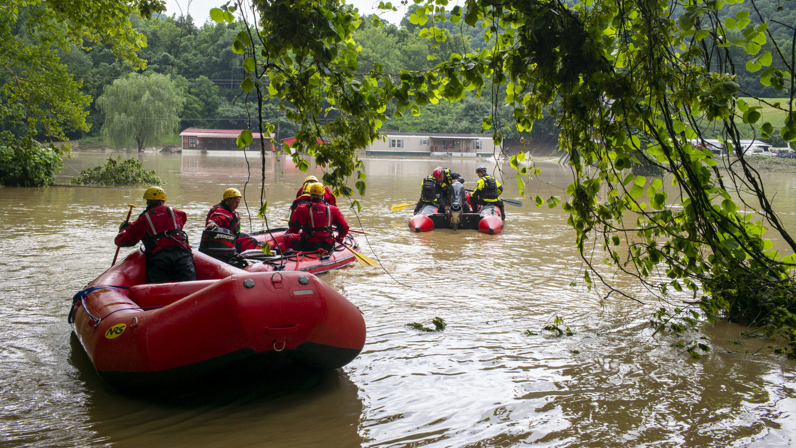 FILE: Lexington Firefighters' swift water rescue teams head up overflowed Troublesome Creek to resc...