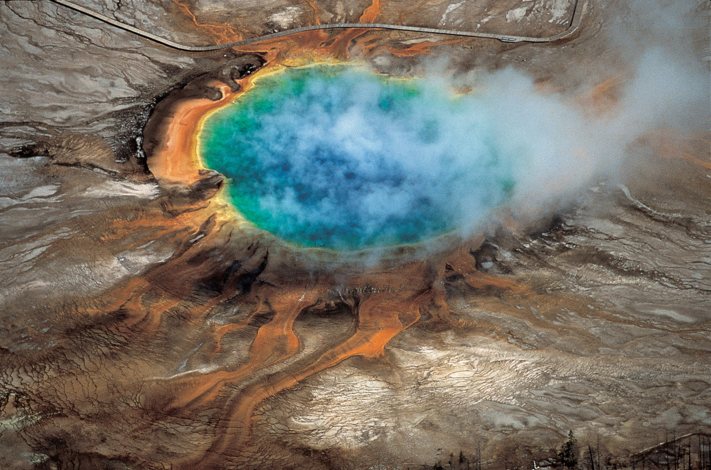 The brilliant colors of Yellowstone National Park’s Grand Prismatic hot spring are among the park...