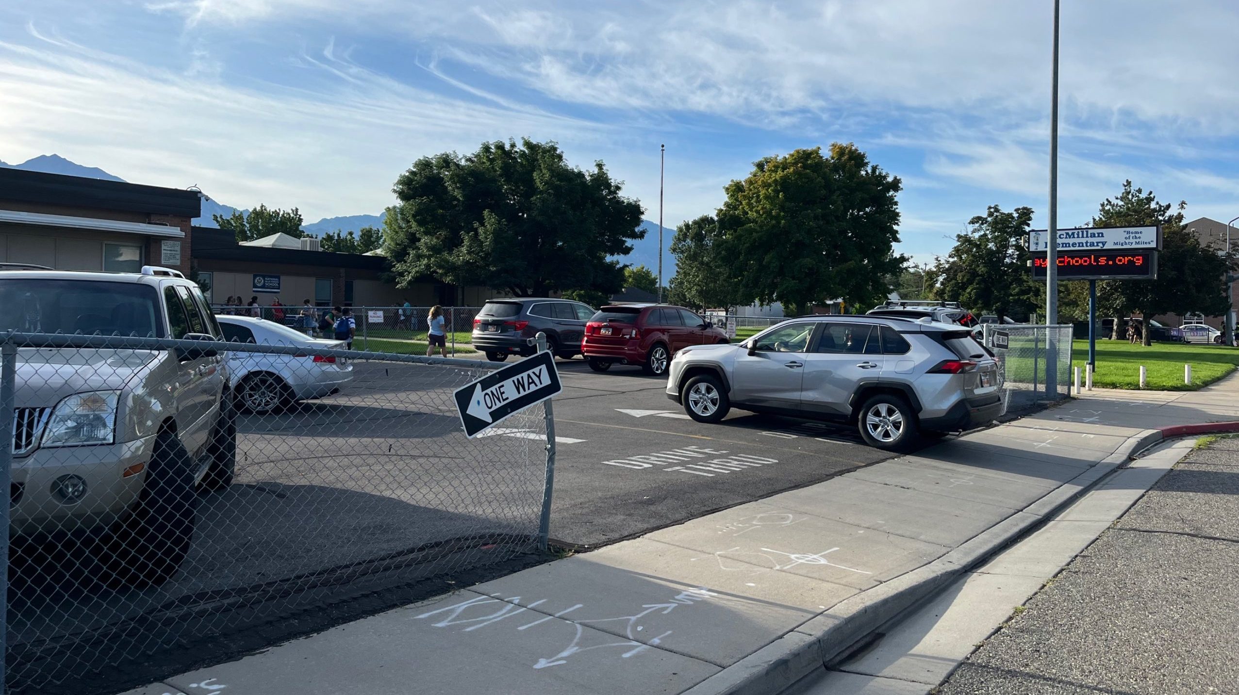 parents side hustle: murray school district first day cars lined up...