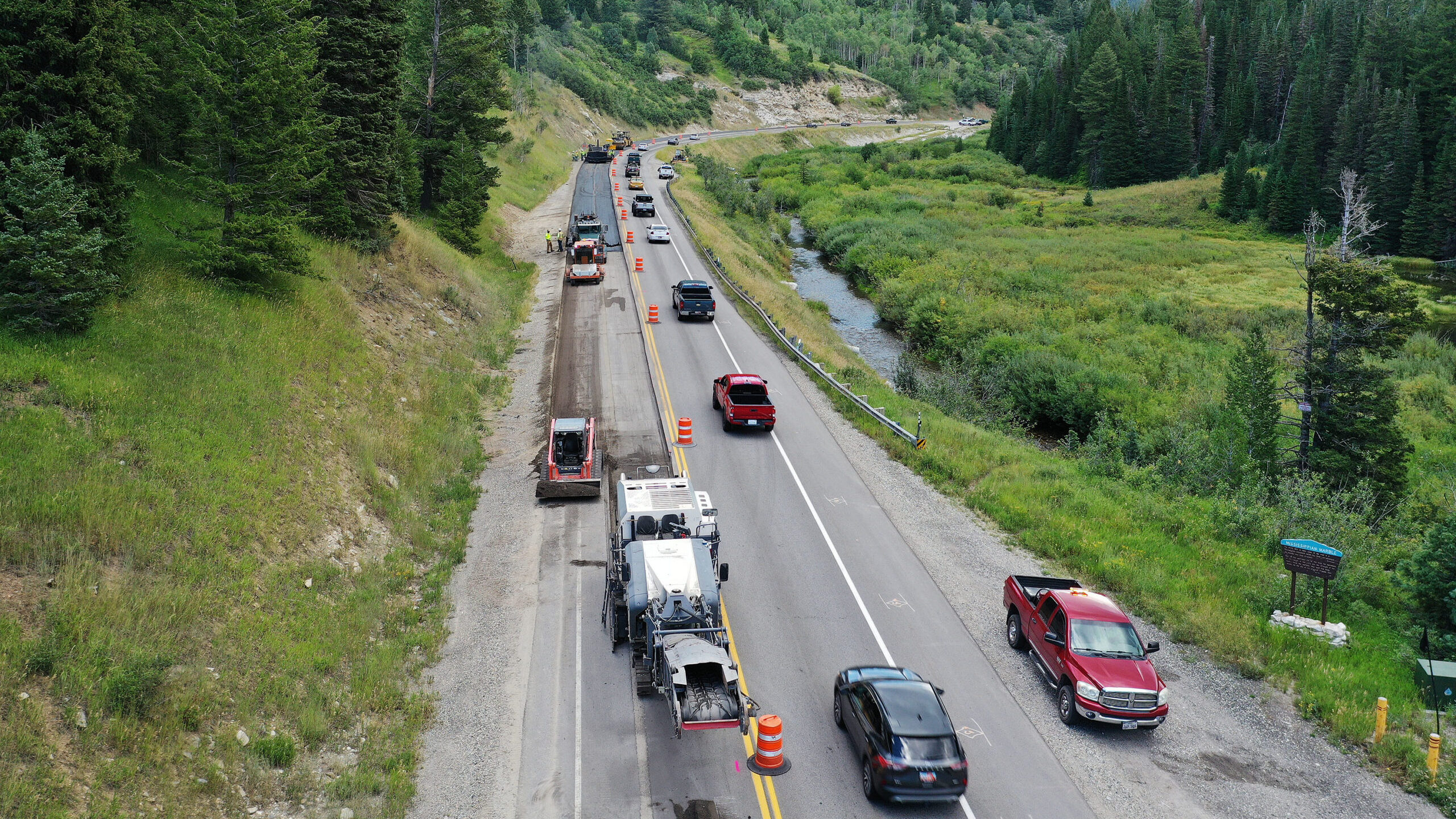Traffic moves in a single lane as Rocky Mountain Power crews bury overhead power lines in Big Cotto...