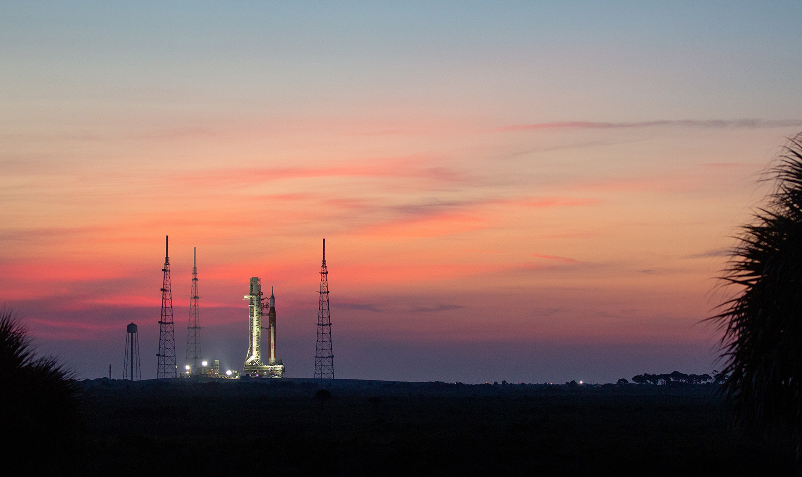 NASA’s Space Launch System (SLS) rocket with the Orion spacecraft aboard is seen at sunrise atop ...