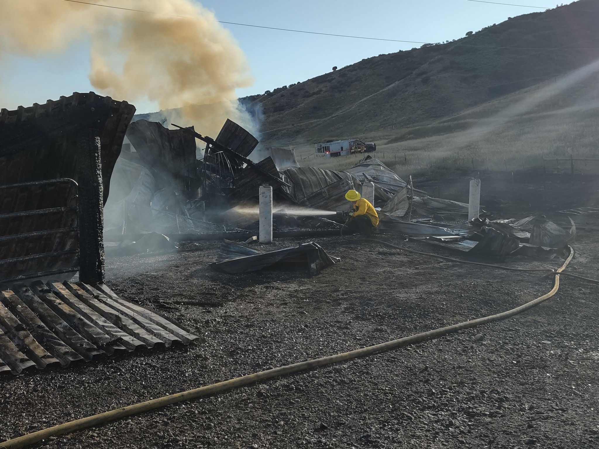 A fire in Huff Creek burns down three barns, resulting in a complete loss of each structure. Photo ...