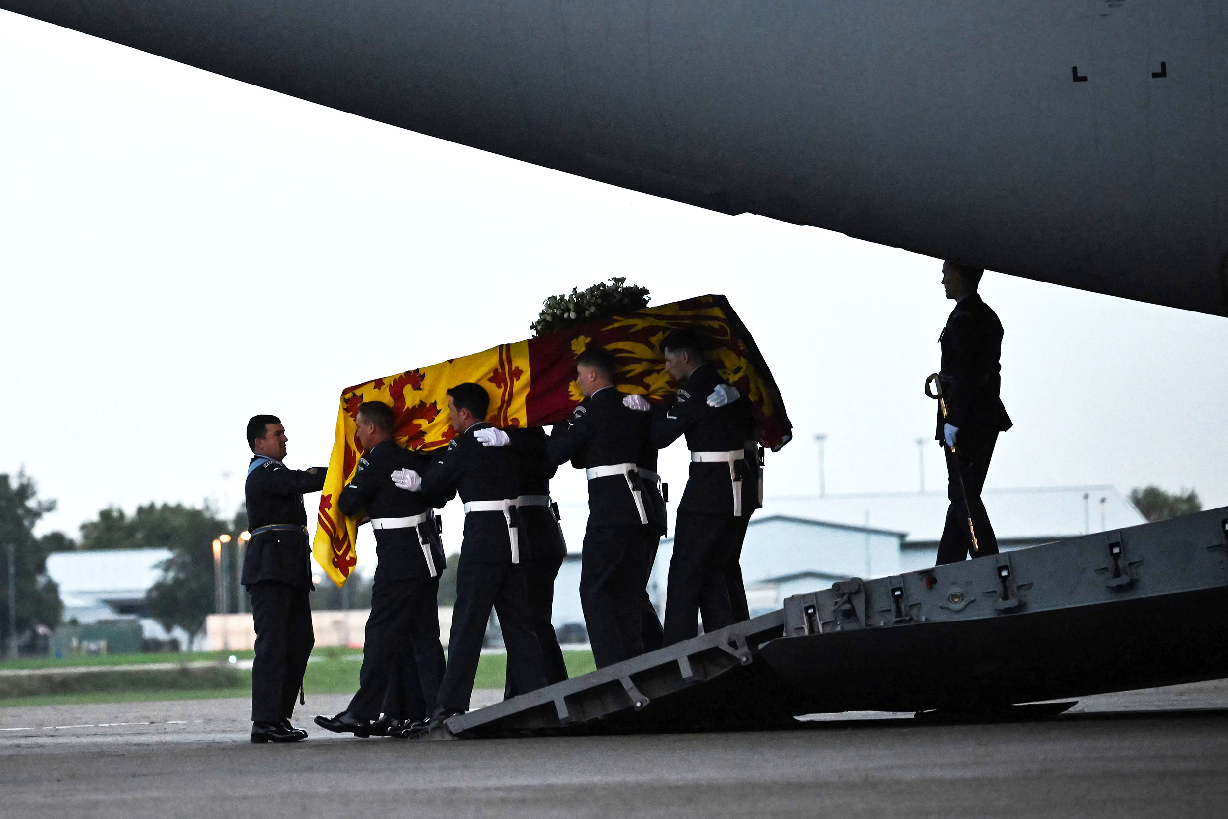 Pallbearers from the Queen's Colour Squadron (63 Squadron RAF Regiment) carry the coffin of Queen E...