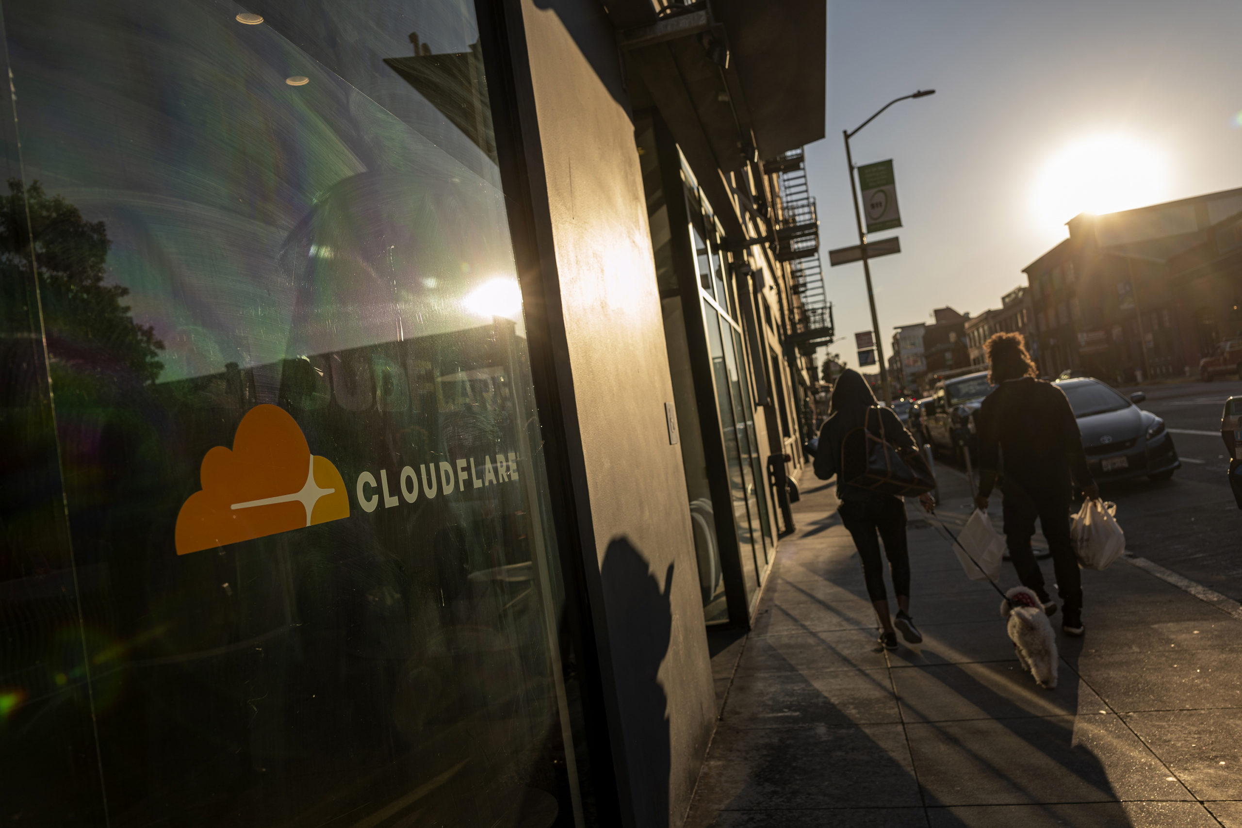 Pedestrians outside the Cloudflare headquarters in San Francisco, California, U.S., on Tuesday, Feb...