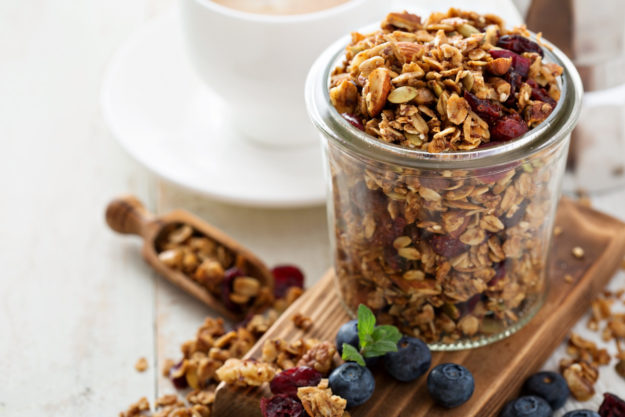 Homemade trail mix with nuts and seeds in a glass jar