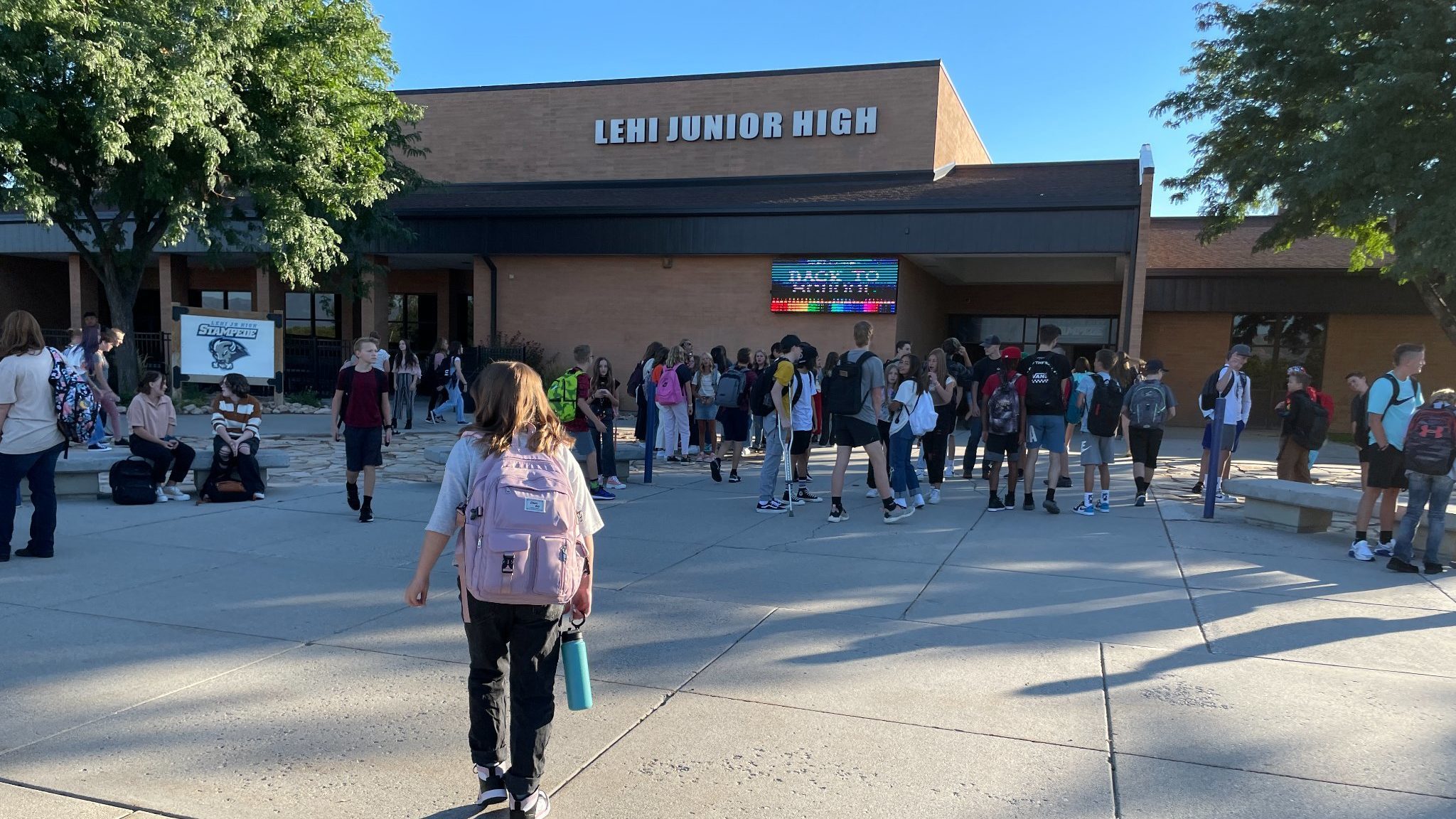 Alpine school district students walk outside of Lehi Junior High...