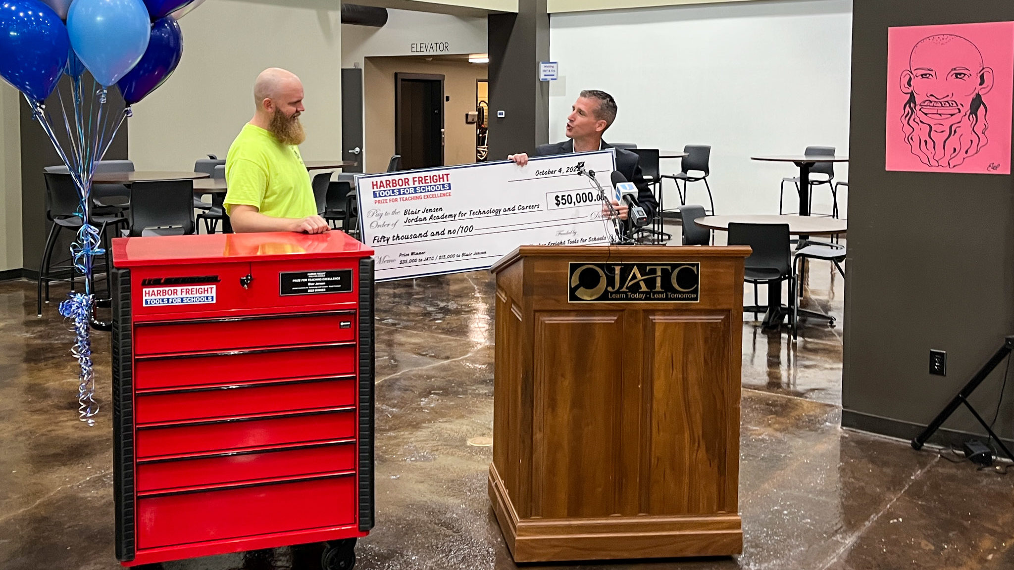 Utah teacher Blair Jensen is awarded a check for $50,000 as one of 20 national winners in the 2022 ...