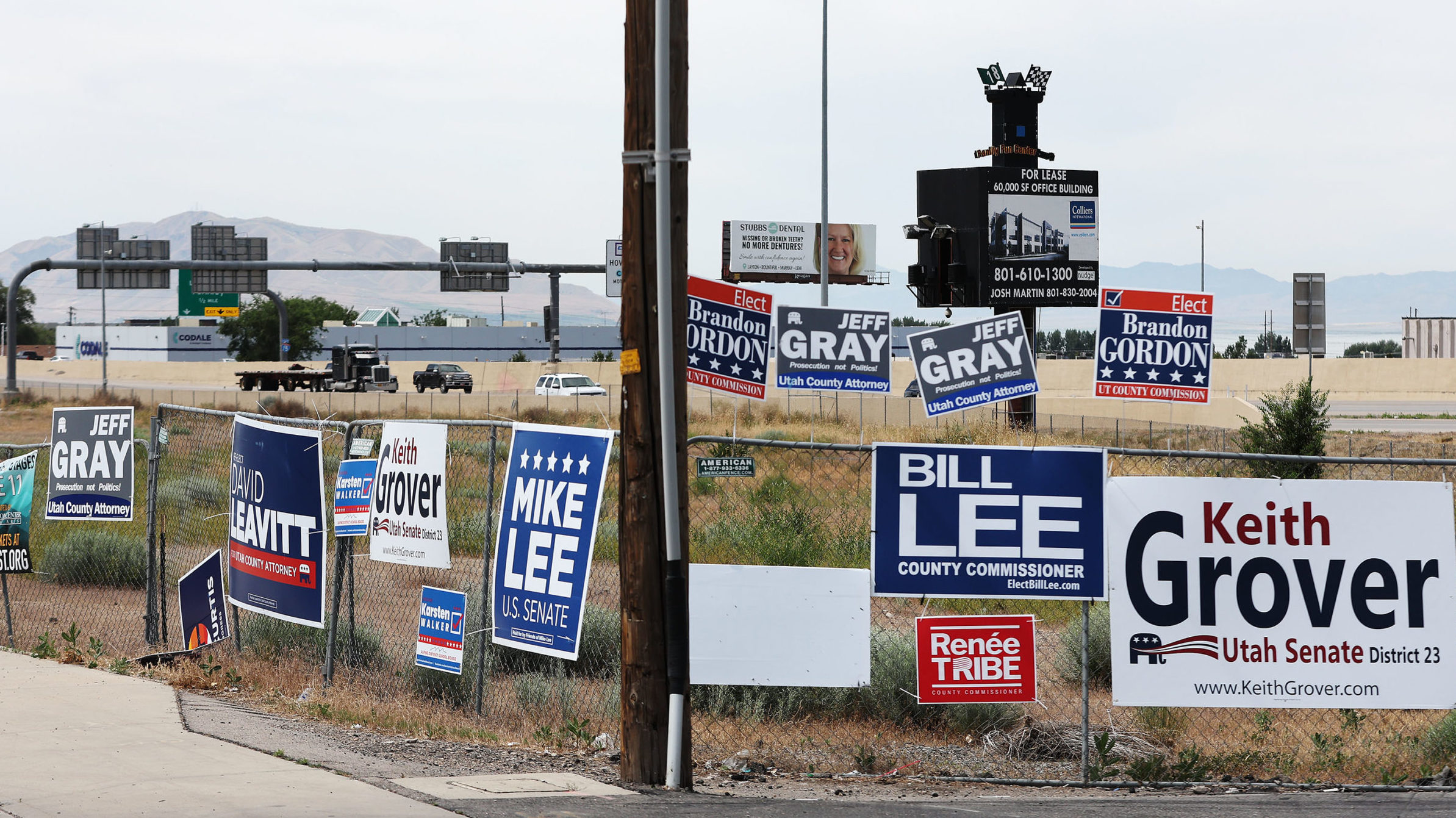 Campaigns signs are displayed near I-15 in Orem on Wednesday, June 22, 2022. (Jeffrey D. Allred/Des...